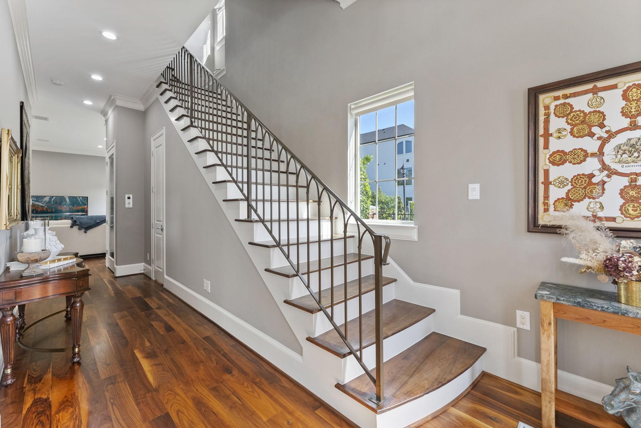 Image 4: Stunning iron staircase with wood steps and natura