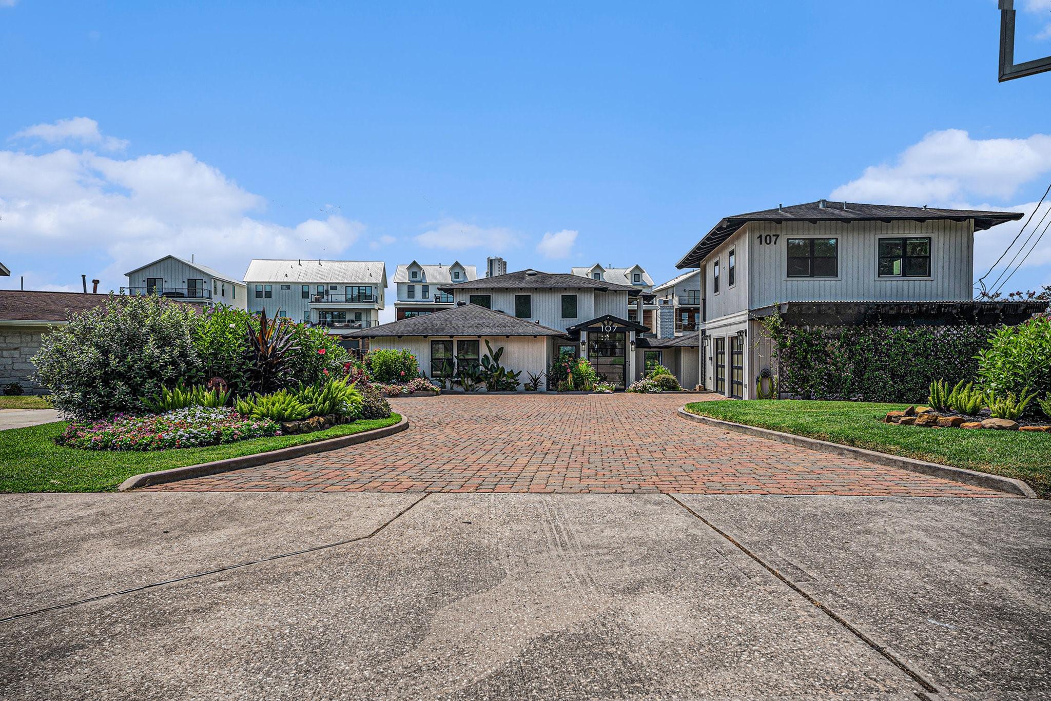Image 3: Daytime front elevation of the property with a spa