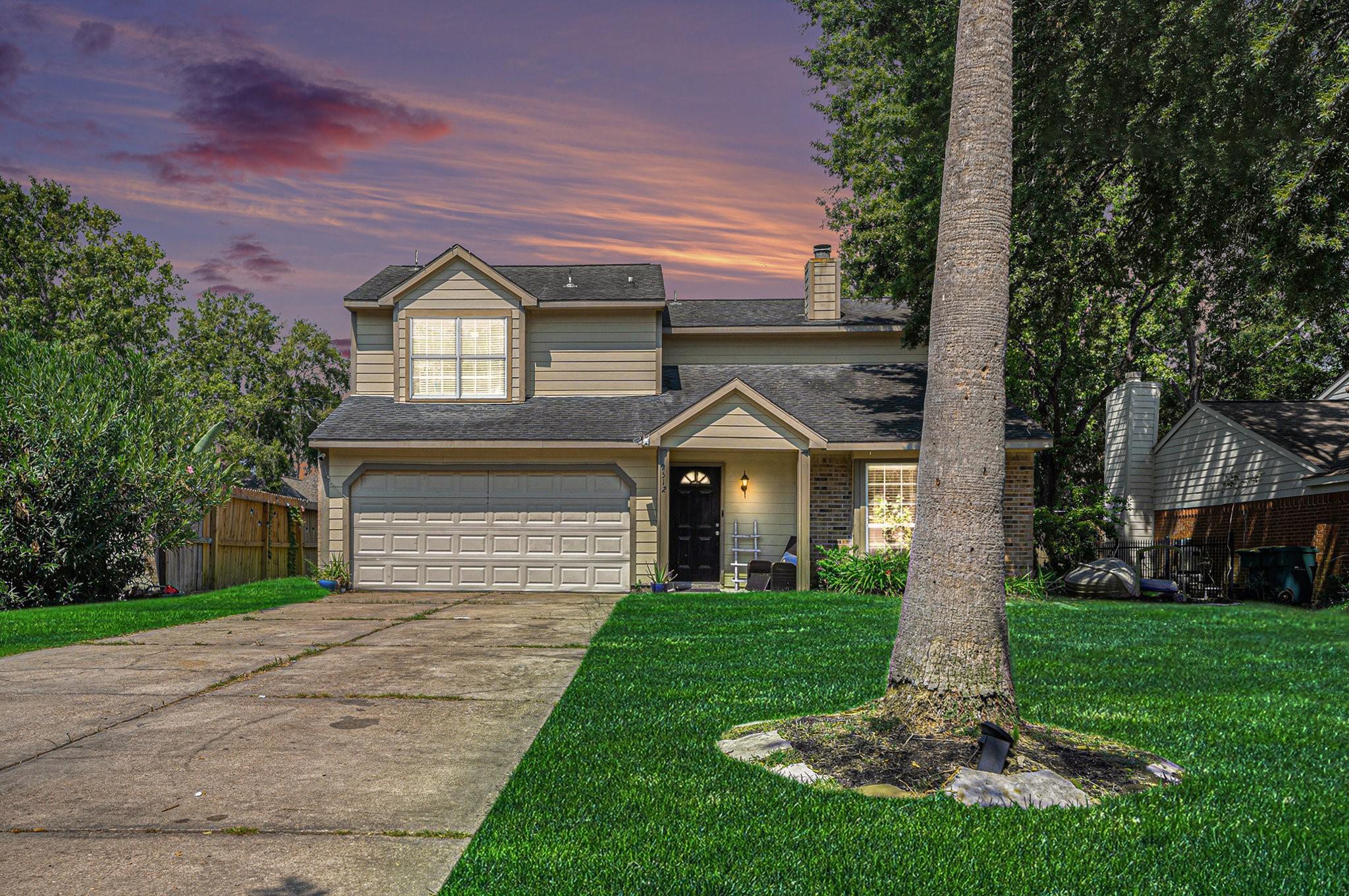 Image 1: Spacious double driveway leading to a two-car gara