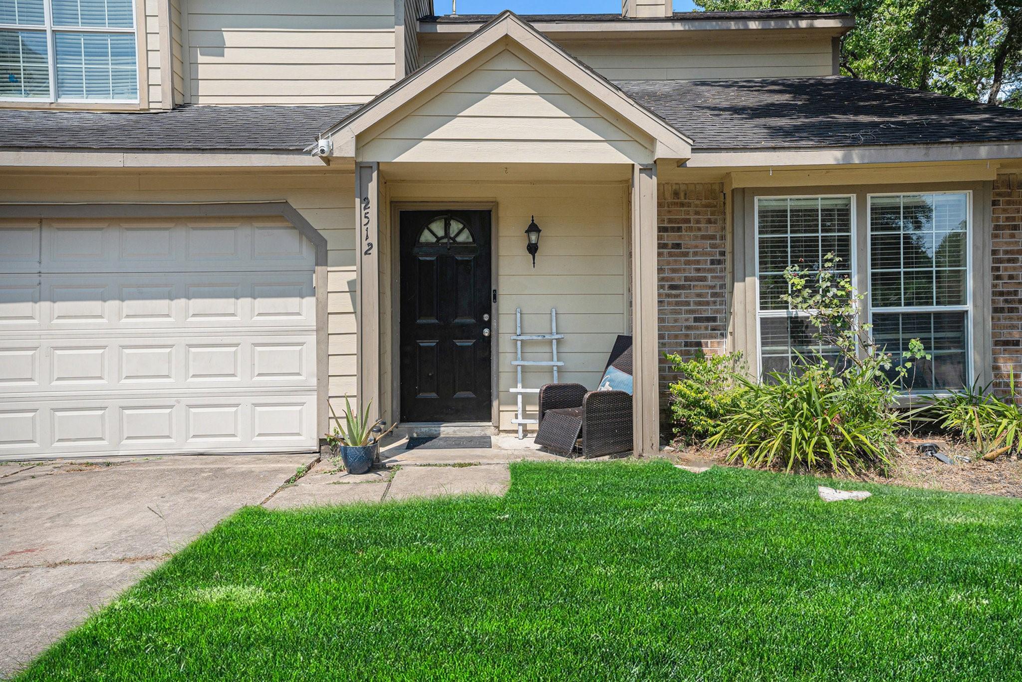 Image 3: Inviting front entry with covered porch, perfect f