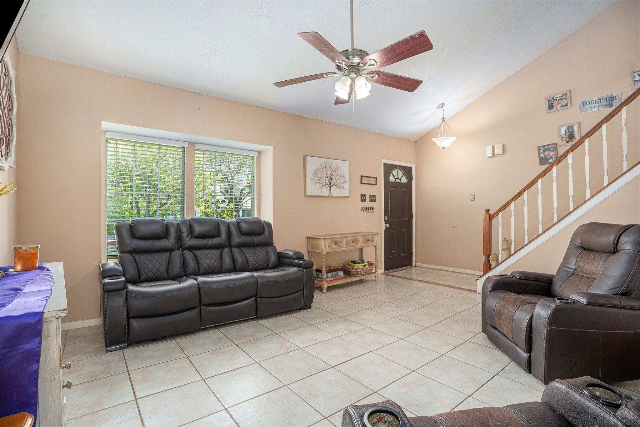Image 4: Bright and welcoming living space with large front