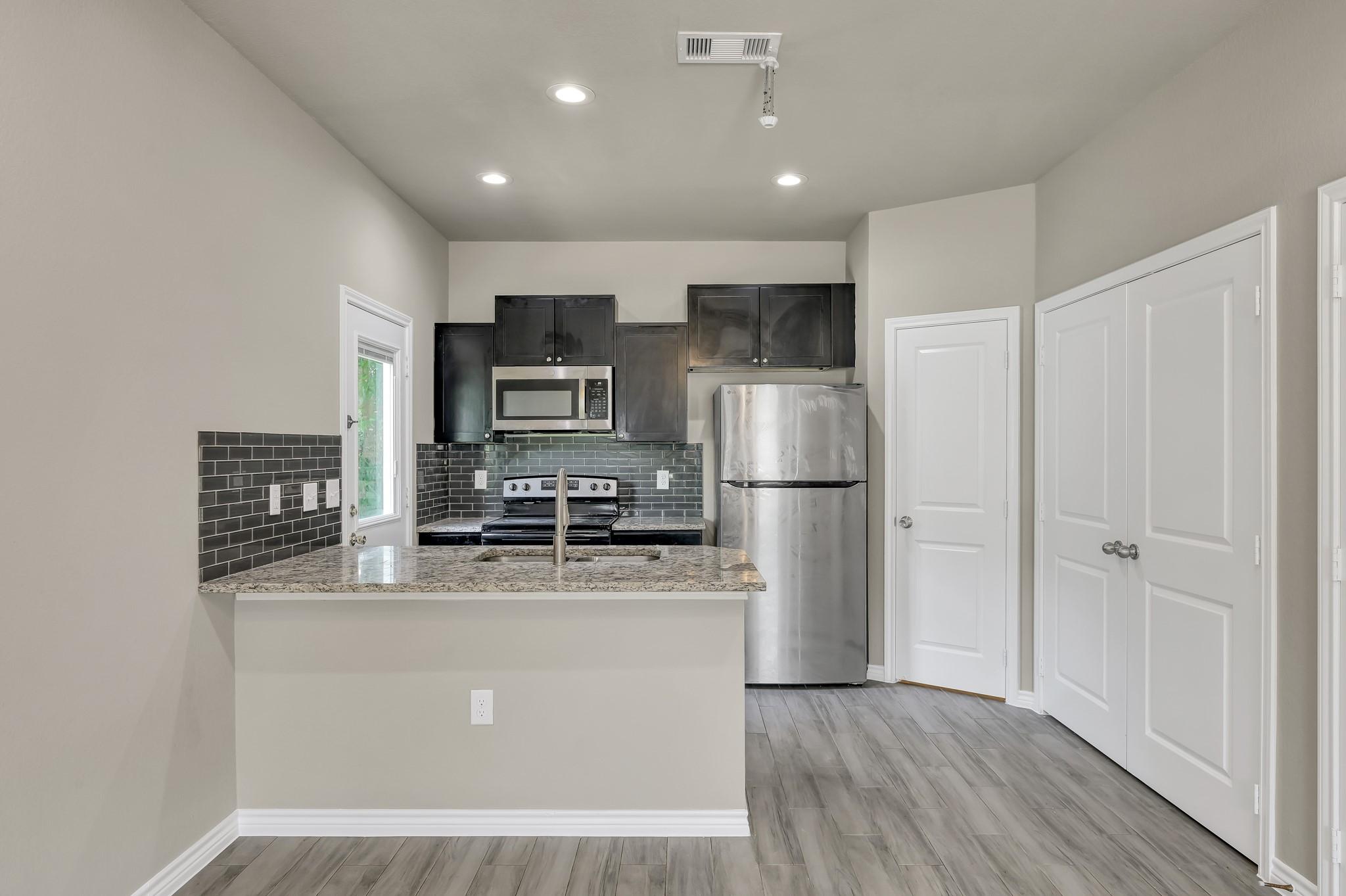Image 3: All new stainless steel kitchen appliances include