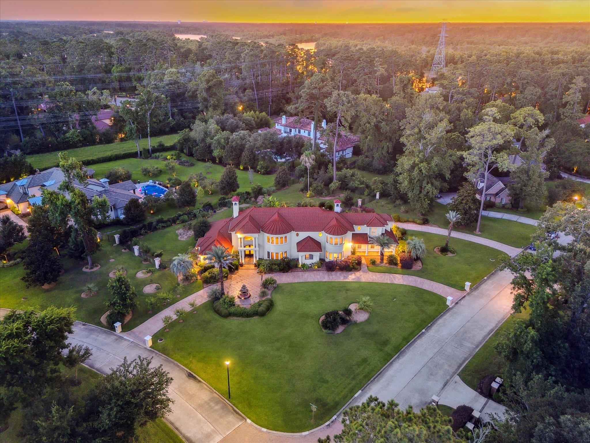 Image 1: Look at the sweeping circle driveway, and distinct