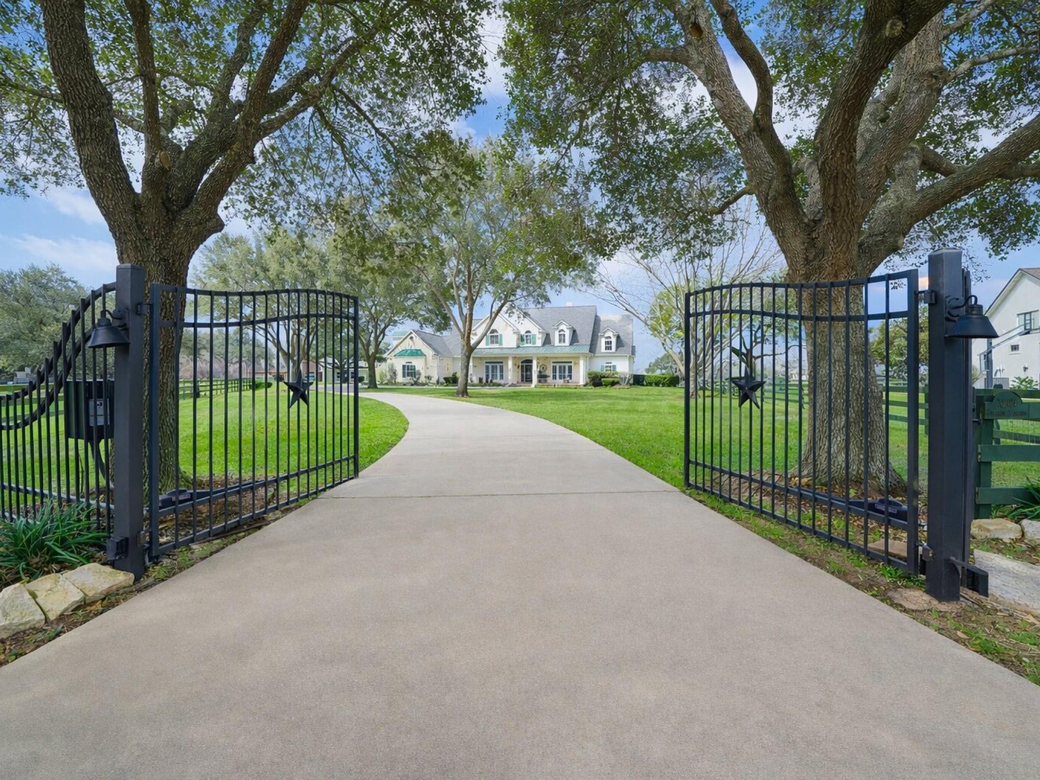 Image 2: A private gated entry sets the tone for arrival, o