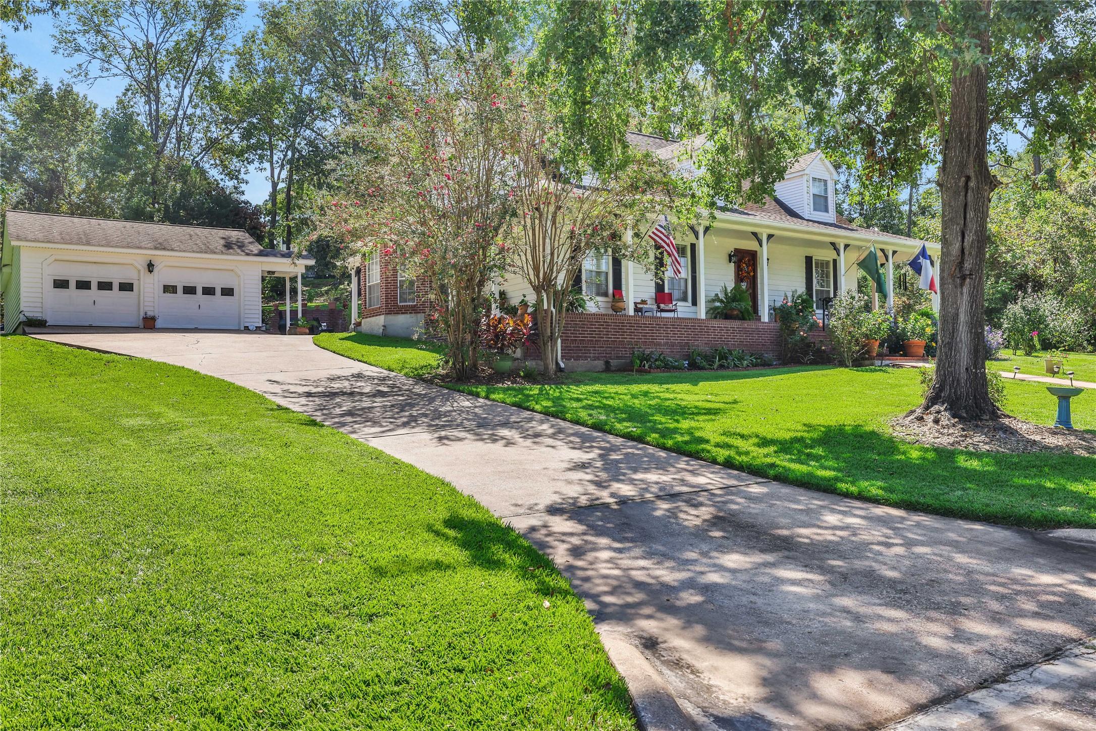 Image 4: The two story home has a detached garage and plent