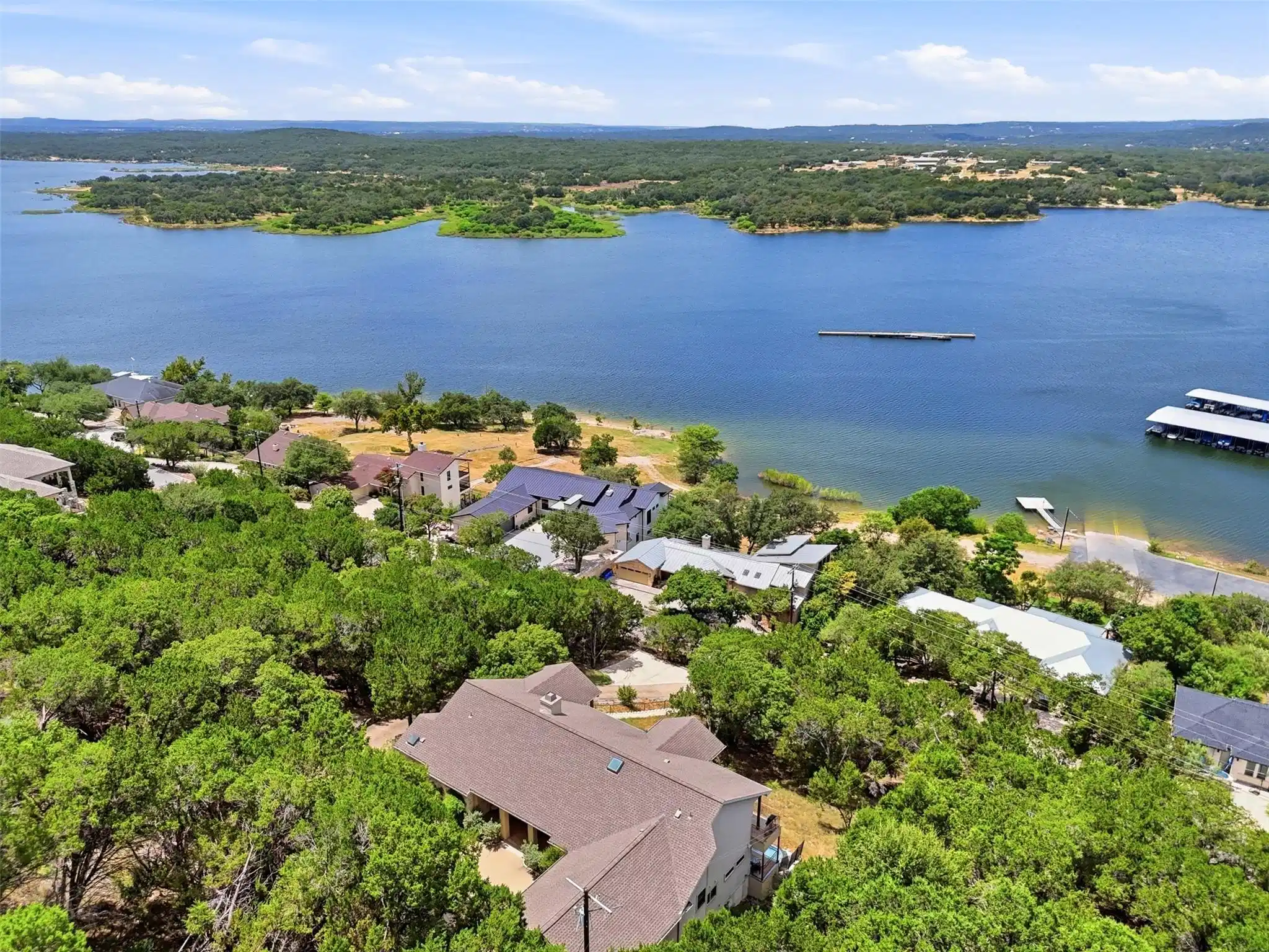Image 1: Breathtaking aerial view showcases Lake Travis, th