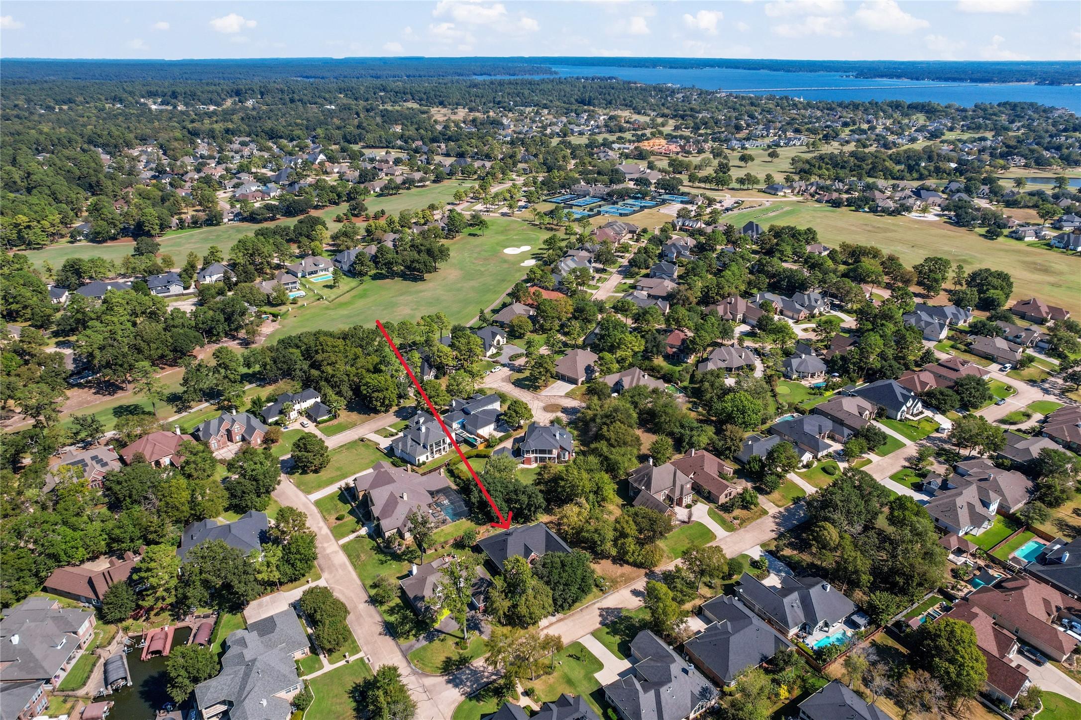 Image 4: Aerial view of the featured home with Bentwater go