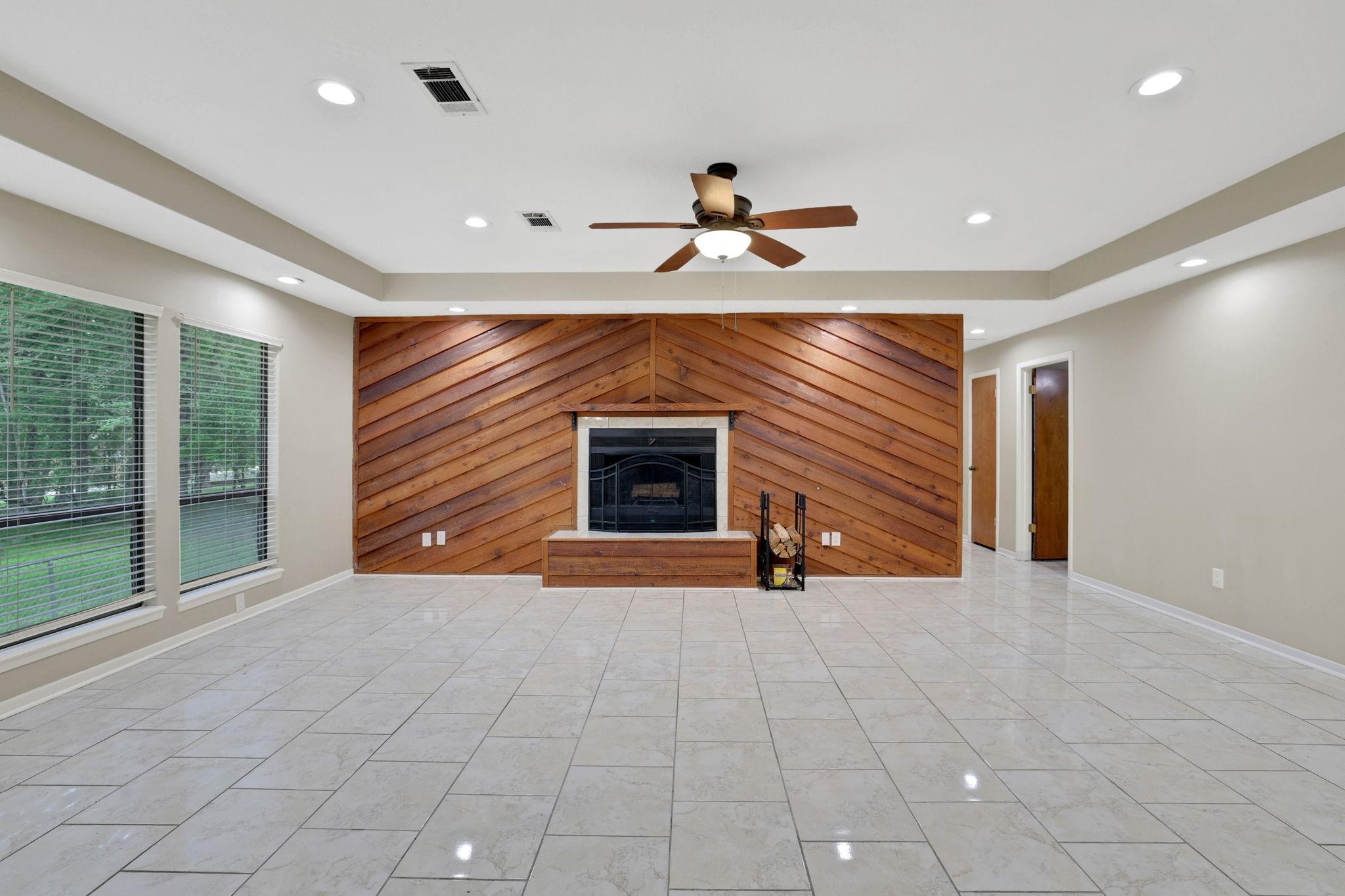 Image 4: Statement fireplace anchors this expansive gatheri