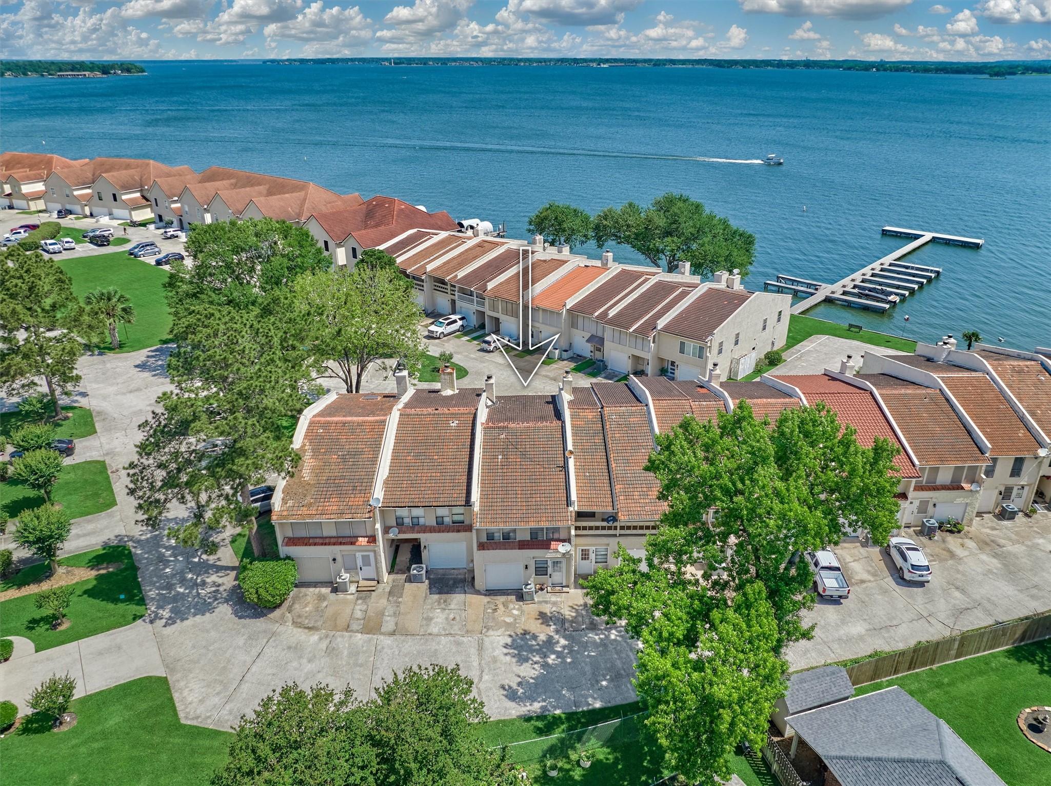Image 1: Savor a serene lakeview in the private, gated encl