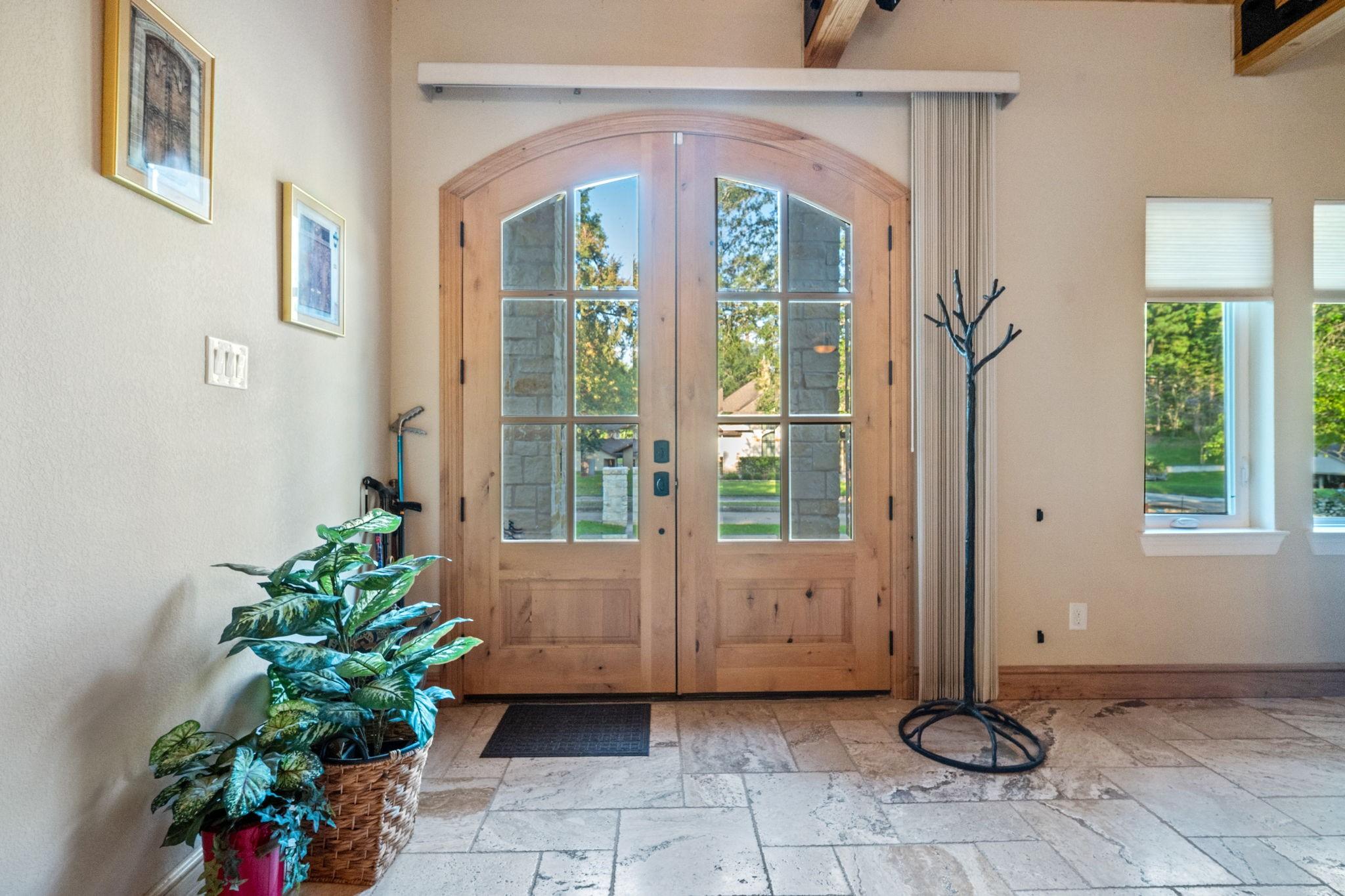 Image 3: Open the double-pane arched door to step into a 24