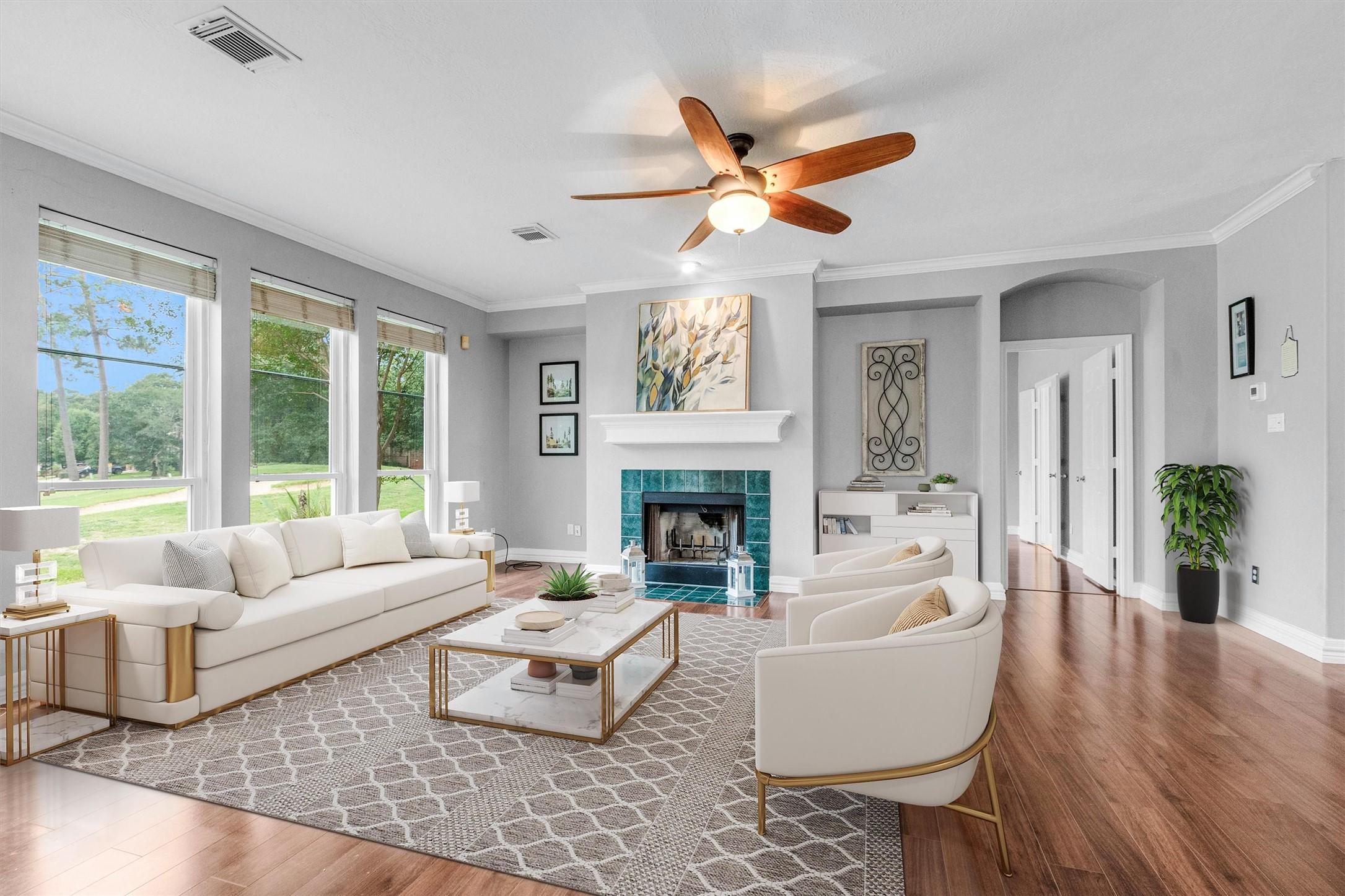 Image 3: Bright and spacious living room featuring large wi