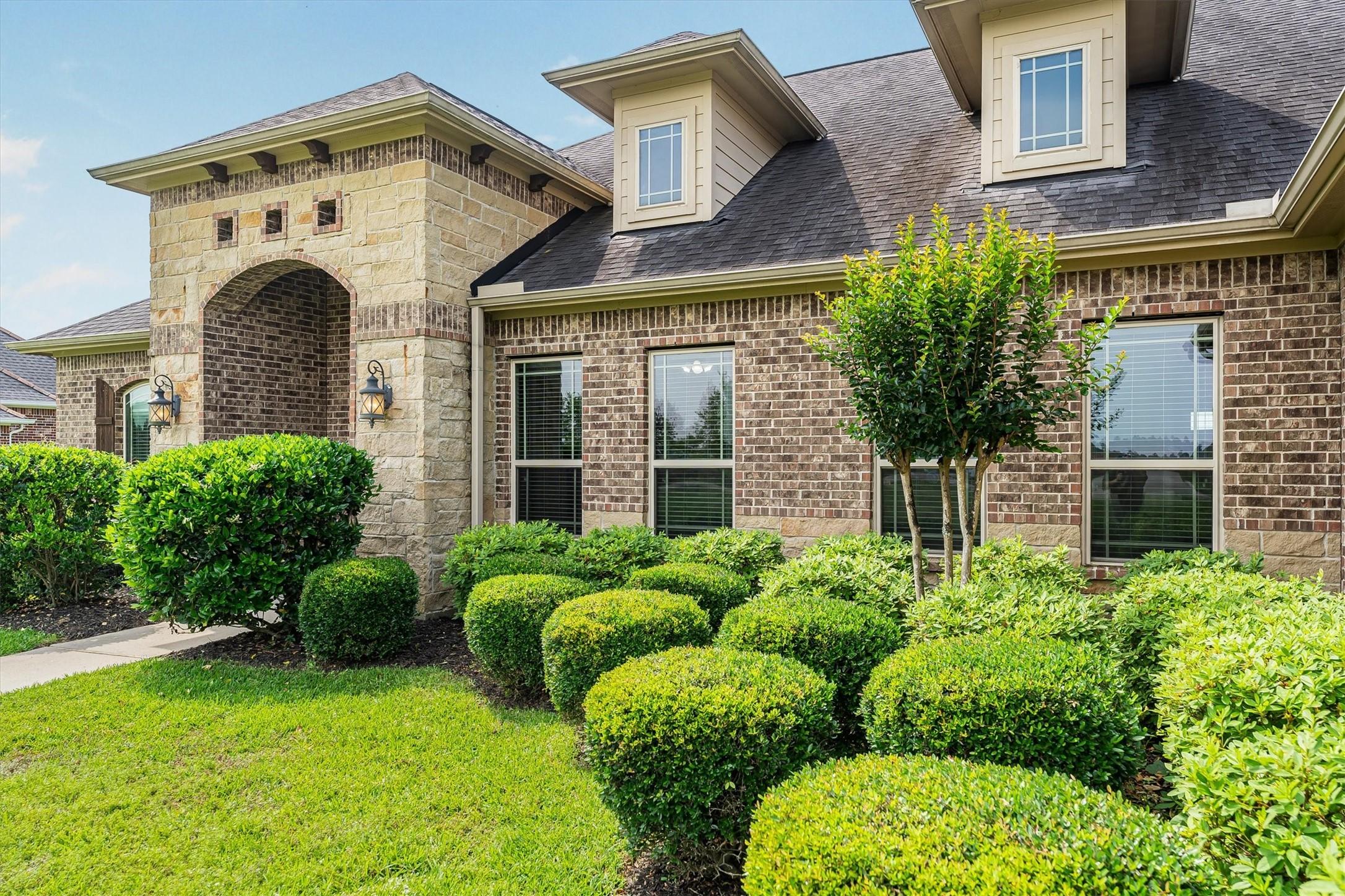 Image 4: Manicured shrubs, Crepe Myrtle trees
 and rose bu