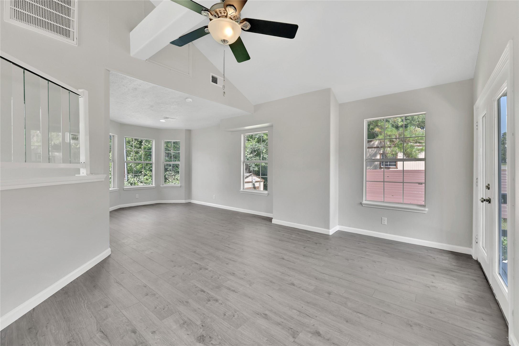 Image 3: The open concept living, dining and kitchen is on