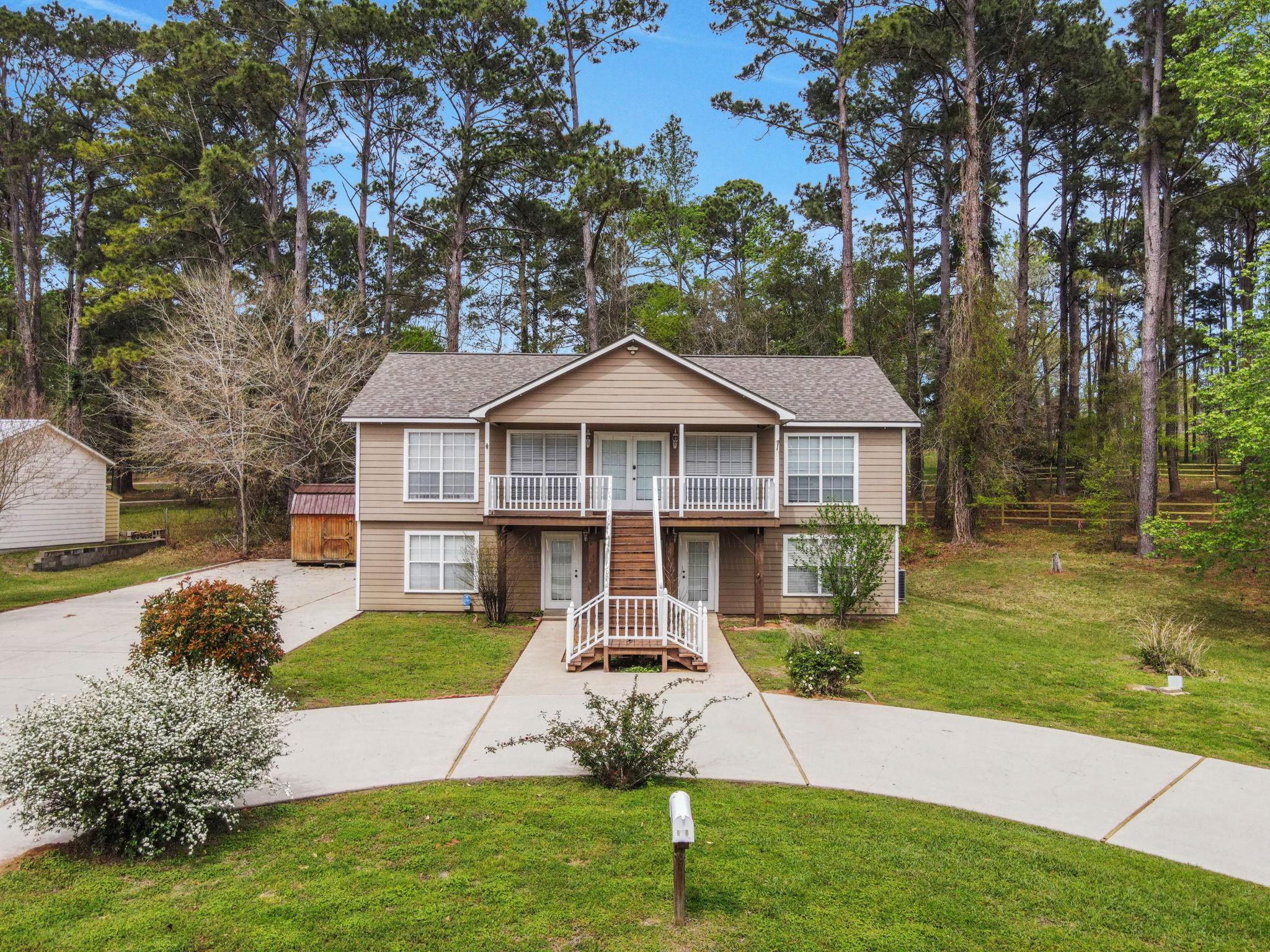 Image 2: The home is situated on TWO lots