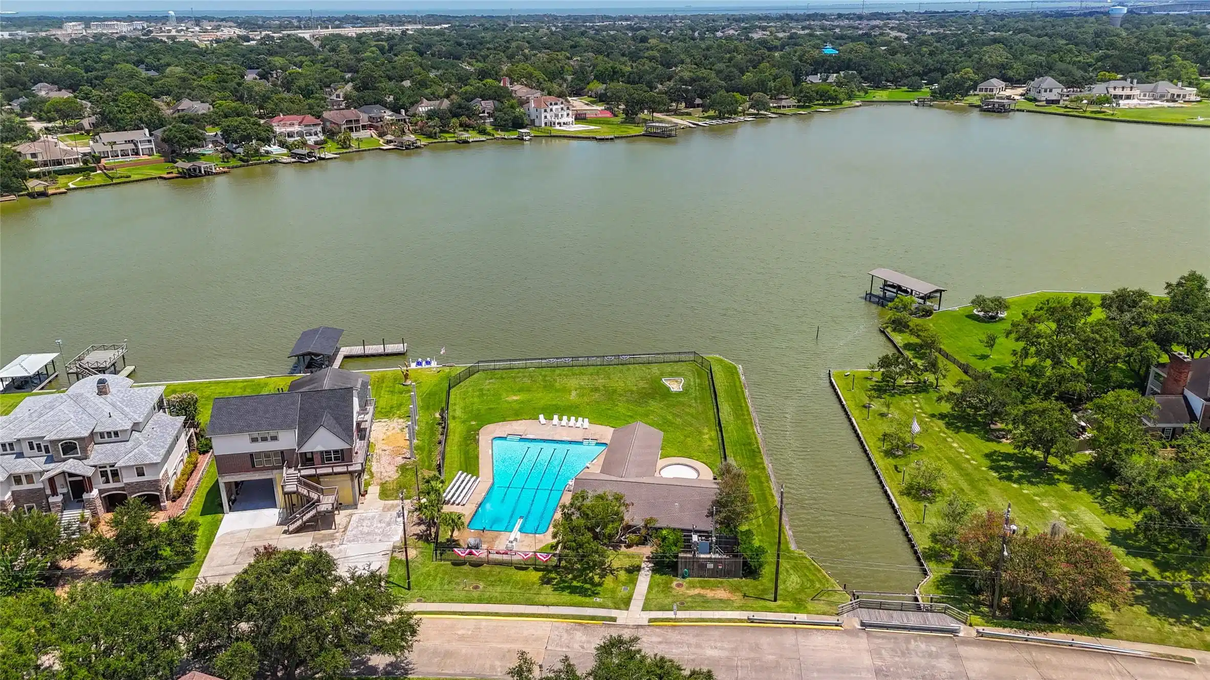 Image 1: Large community pool and pool house overlooking th