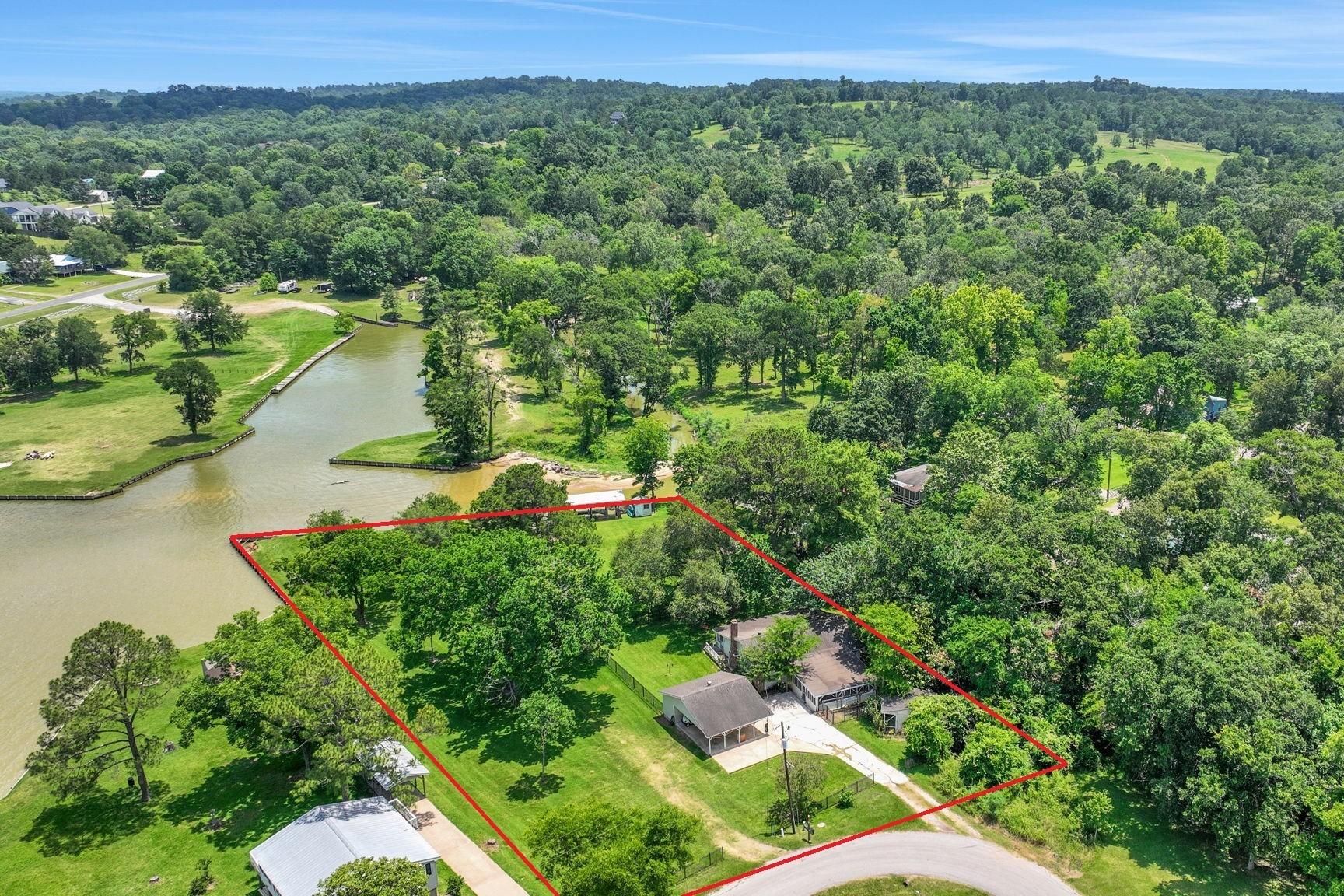 Image 2: This home is situated on an expansive 1.0975 acre