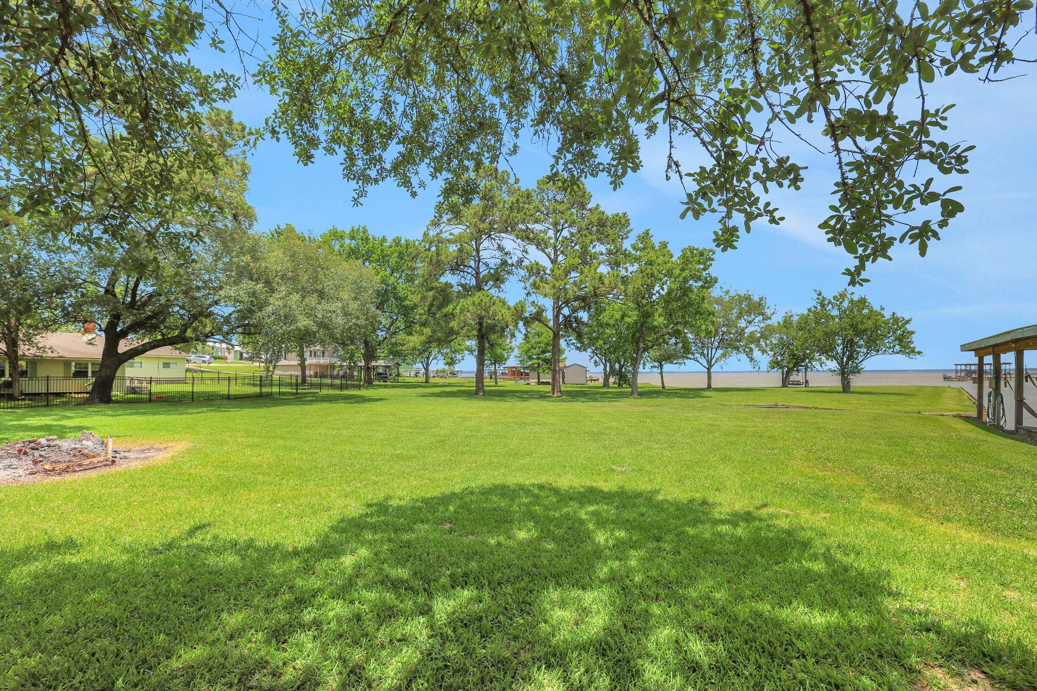 Image 4: The lot beautiful and dotted with shade trees