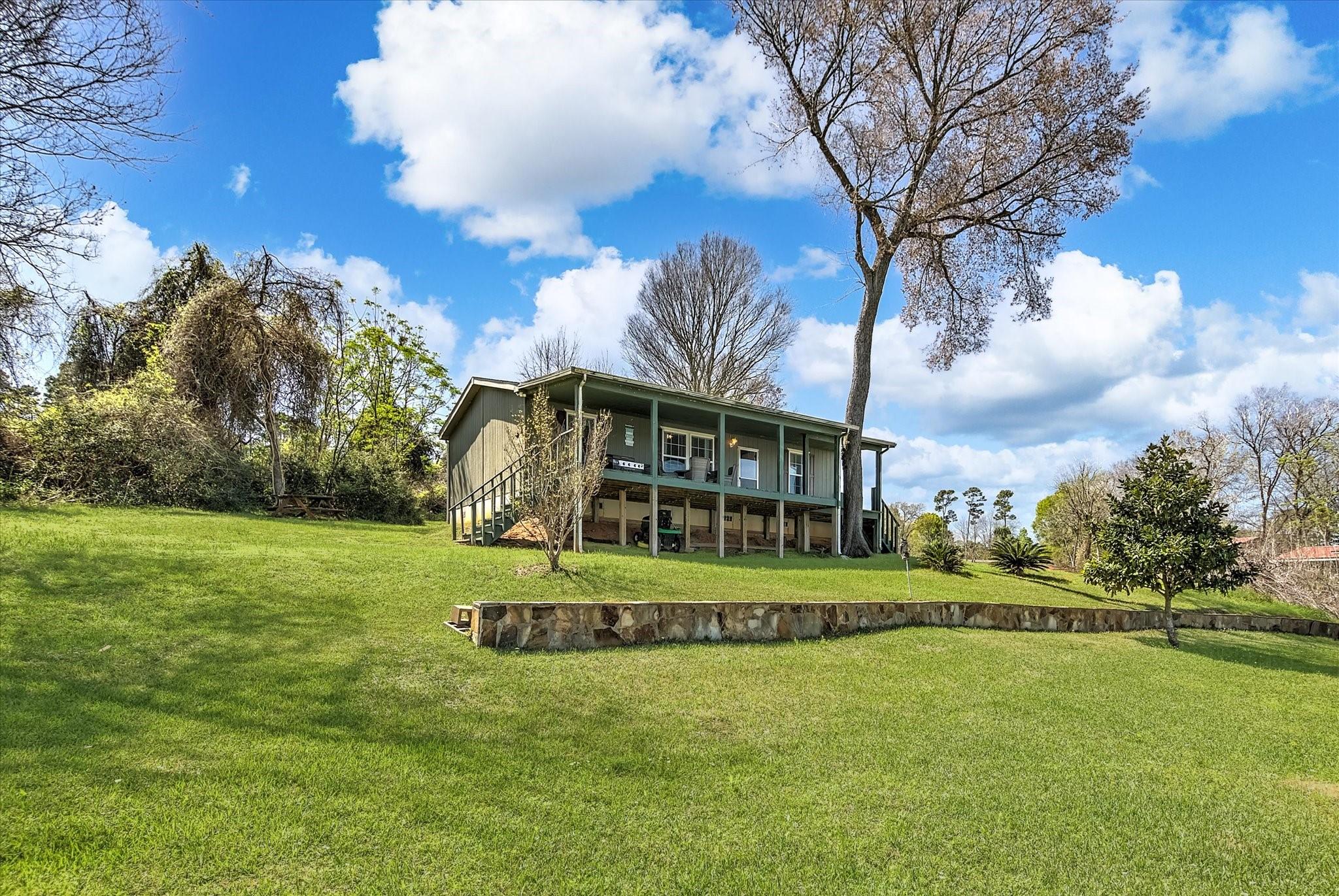 Image 1: View of the house from the water.