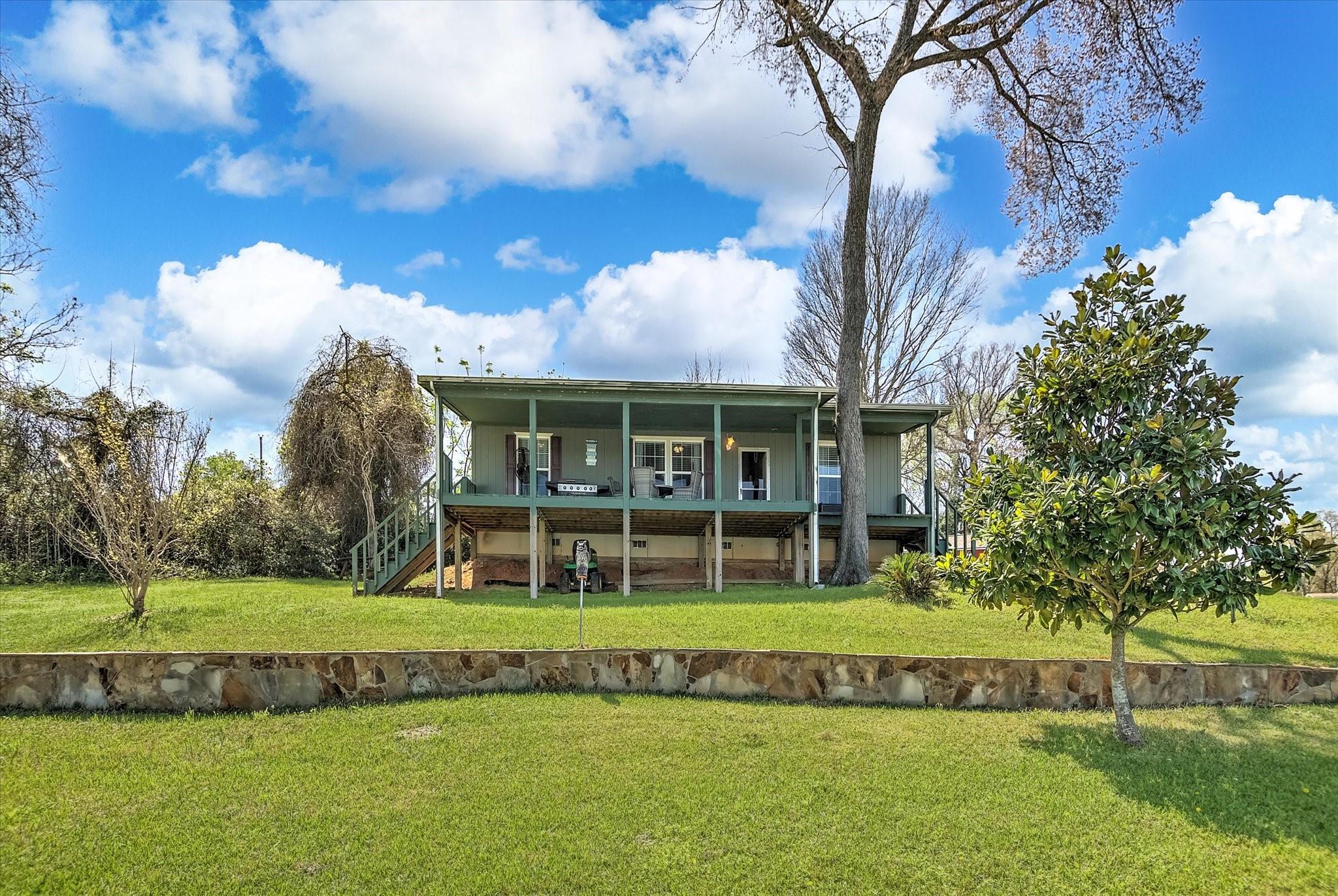 Image 2: View of the house from the water.