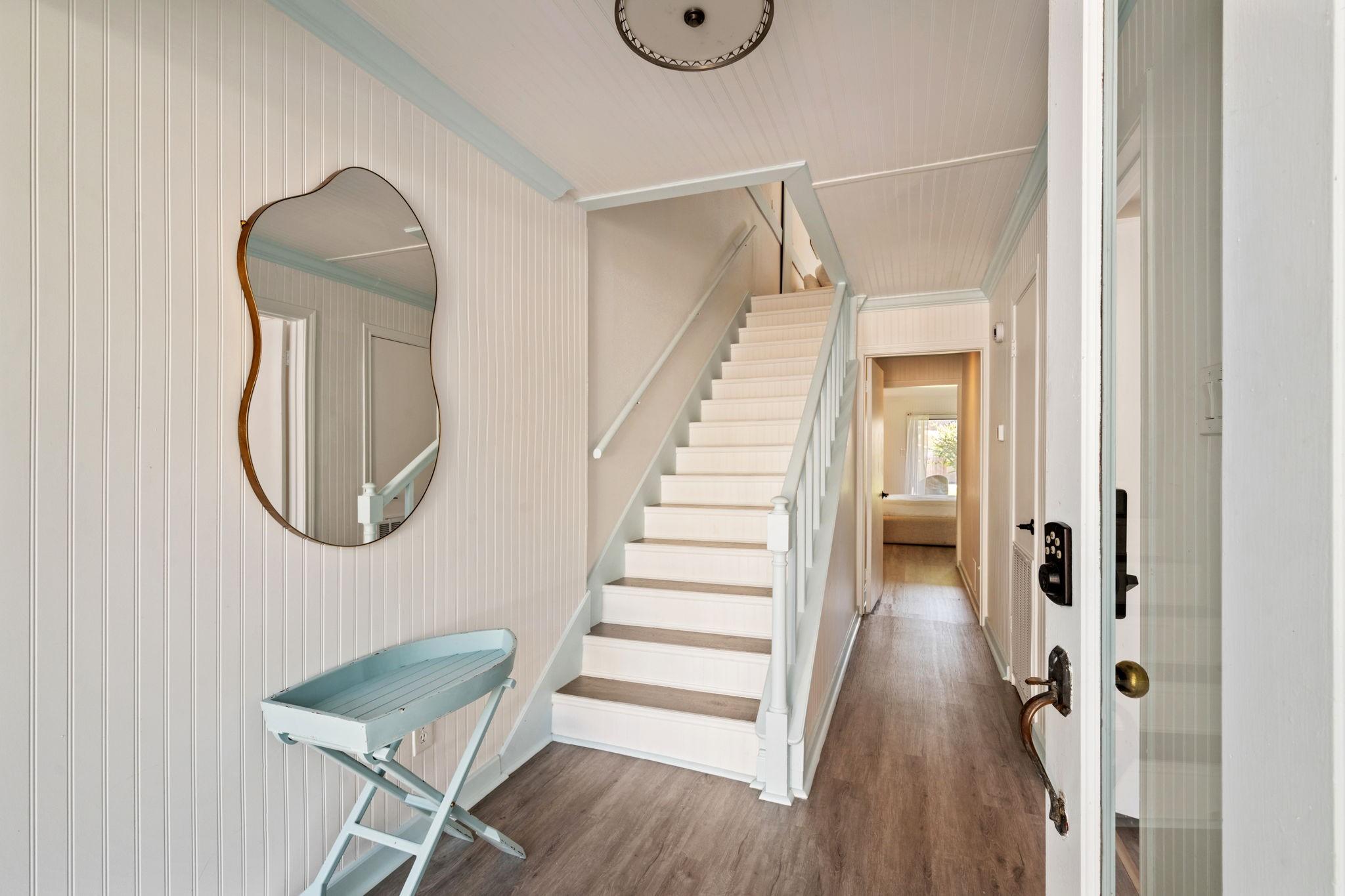 Image 4: As you walk in the front door, you are greeted by