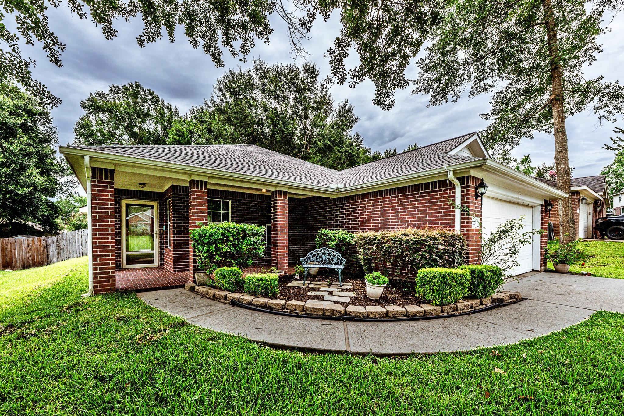 Image 3: Welcoming covered, bricked front porch at 273 Suns
