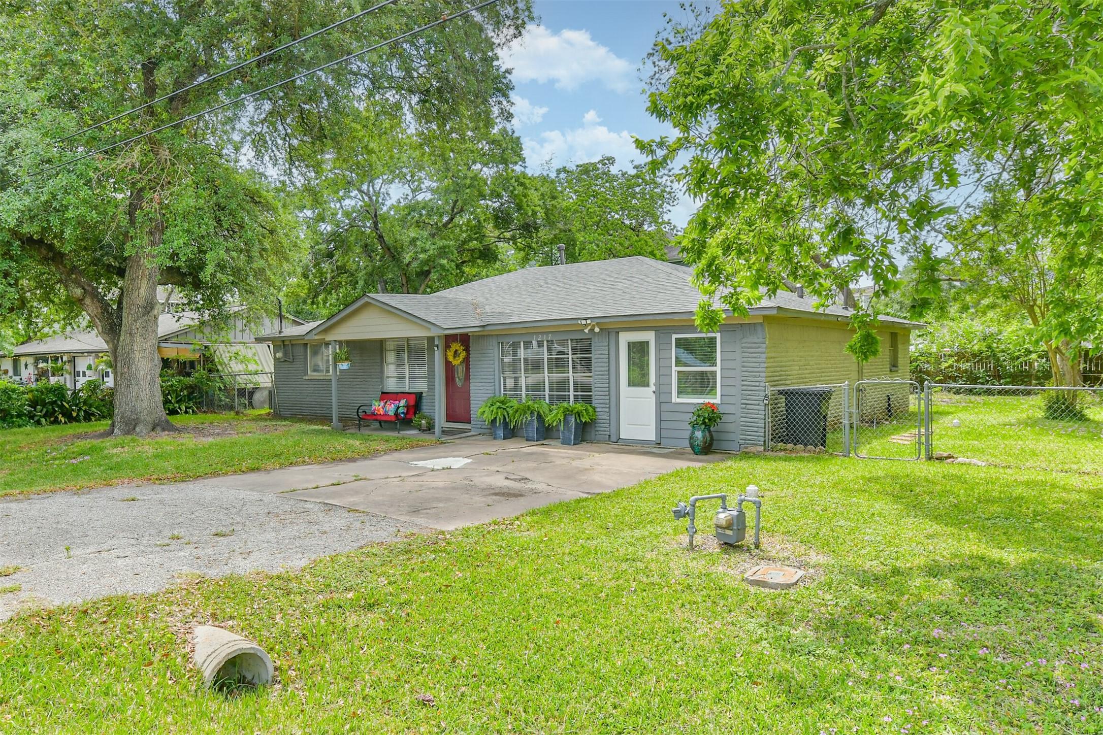 Image 2: Charming single-story home with a cozy front porch