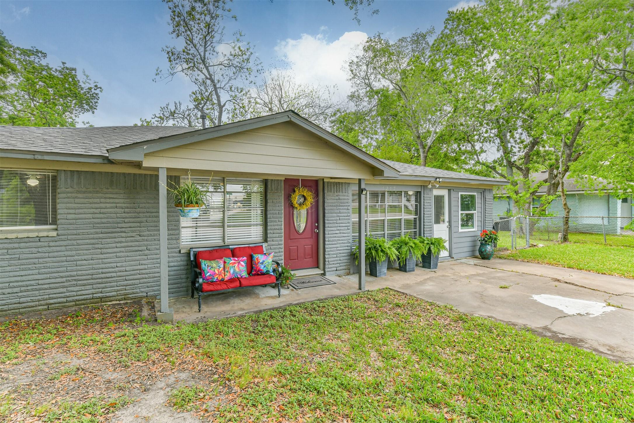 Image 3: This charming home features a welcoming front porc