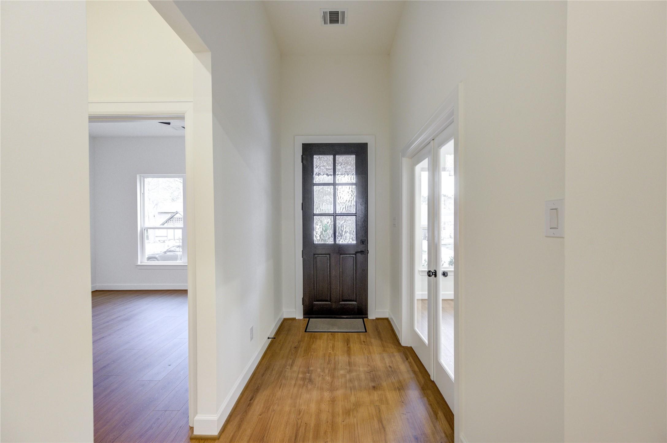 Image 2: Welcome home through a charming front door that op