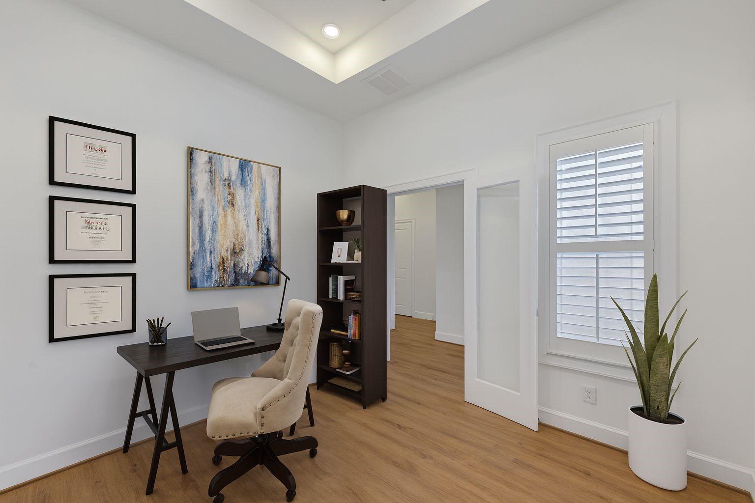 Image 3: This staged study boasts ample natural light, eleg