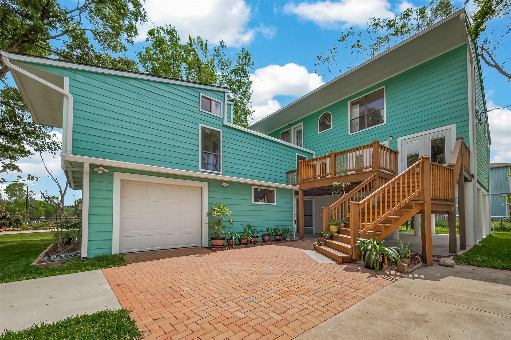 Image 3: DOUBLE WIDE DRIVEWAY OPENS TO THE GARAGE, WORKSHOP
