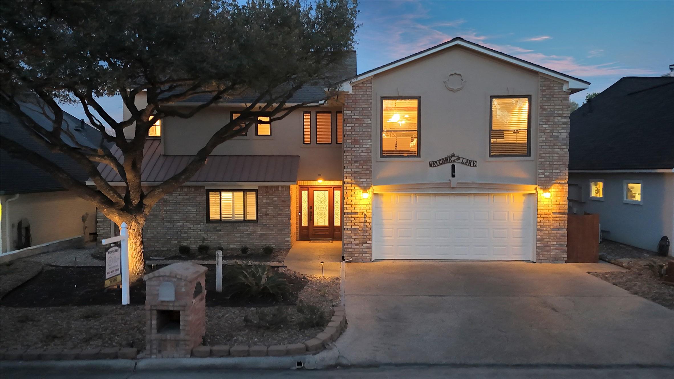 Image 4: The front of the home features a beautifully manic
