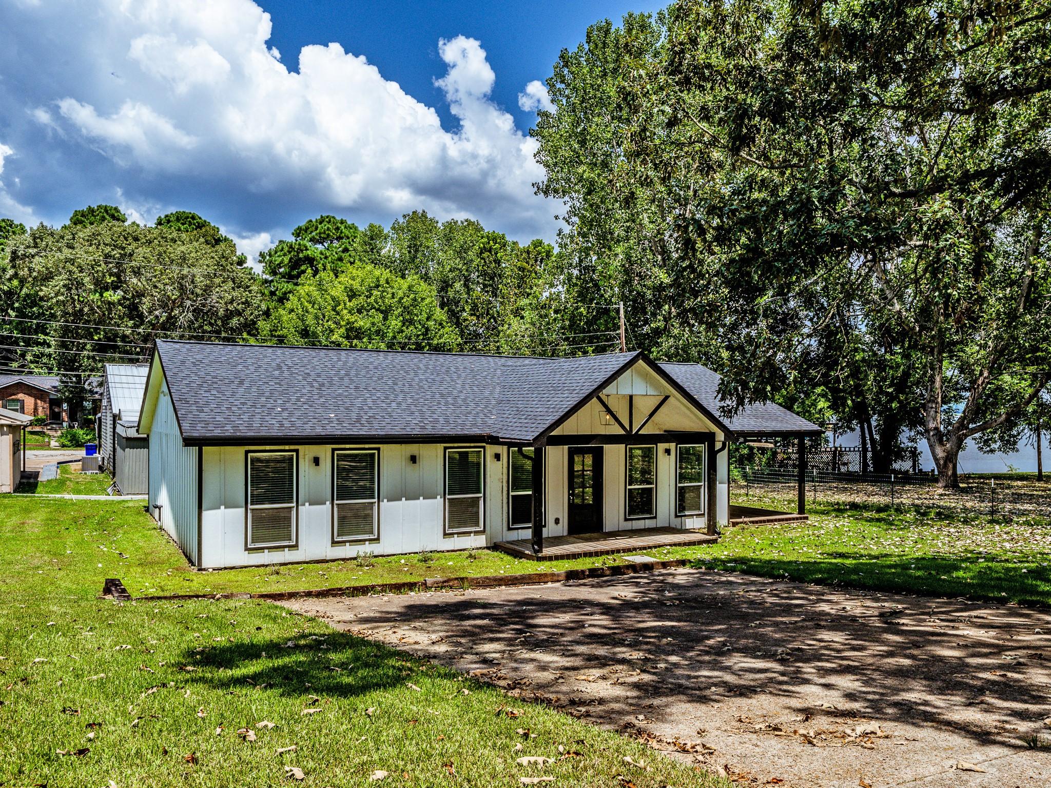 Image 2: Charming single-story home with a modern exterior,