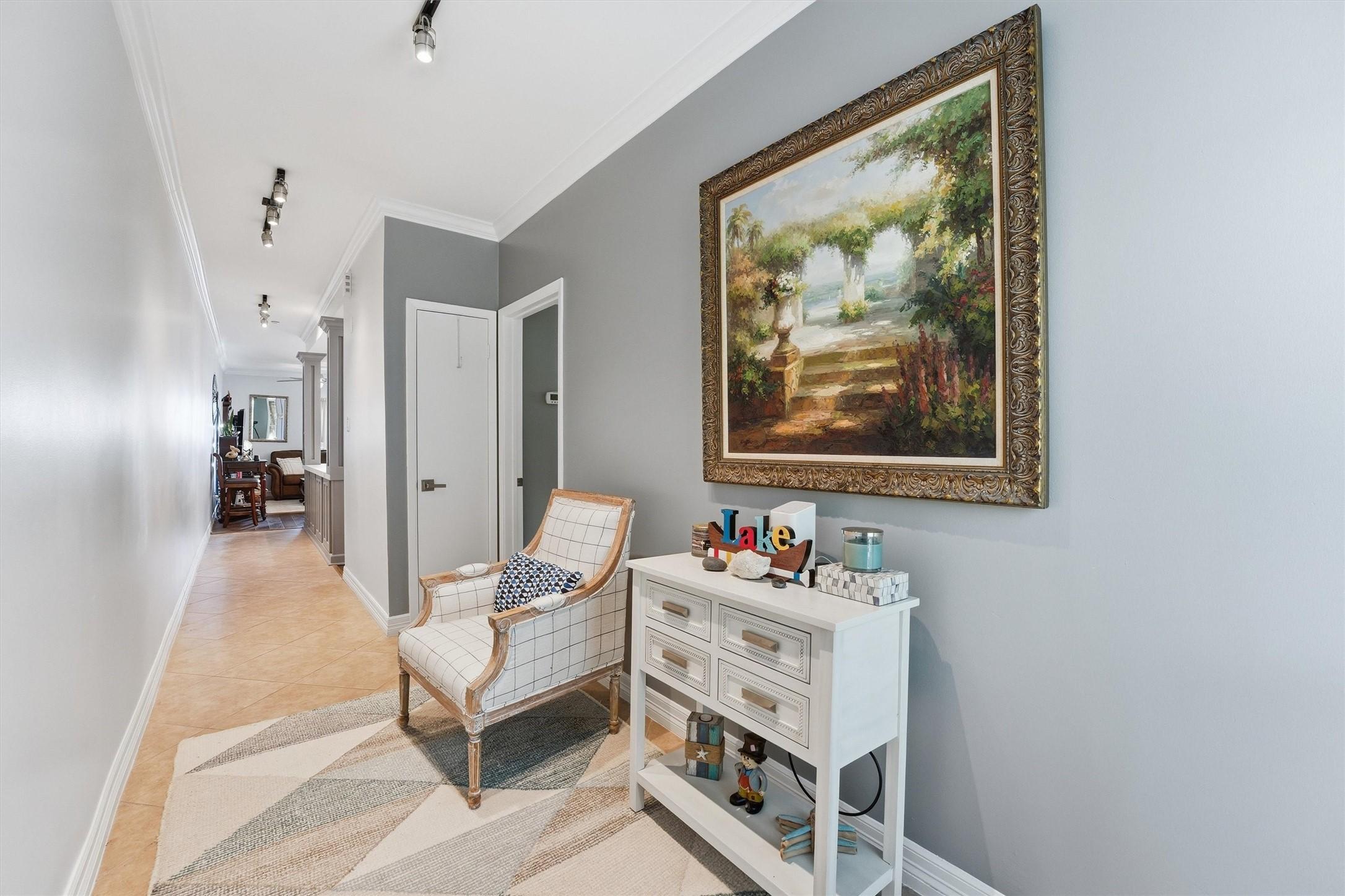 Image 4: Bright, inviting entry hallway sets the tone for t