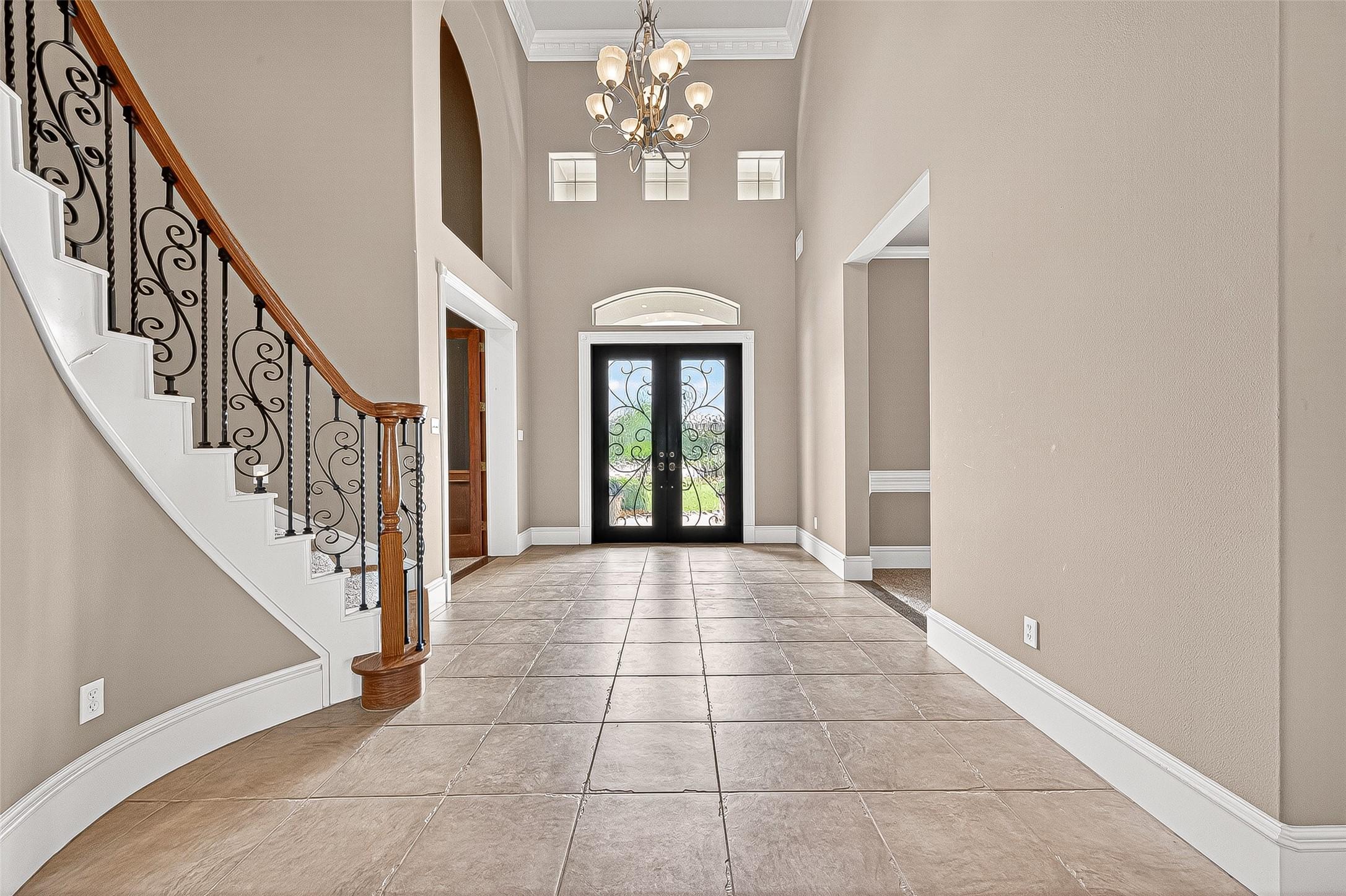 Image 4: Welcome in. You'll find an elegant entryway with h