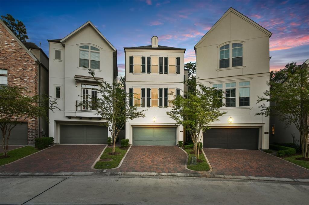 Image 1: Nestled in a serene neighborhood, this elegant tow