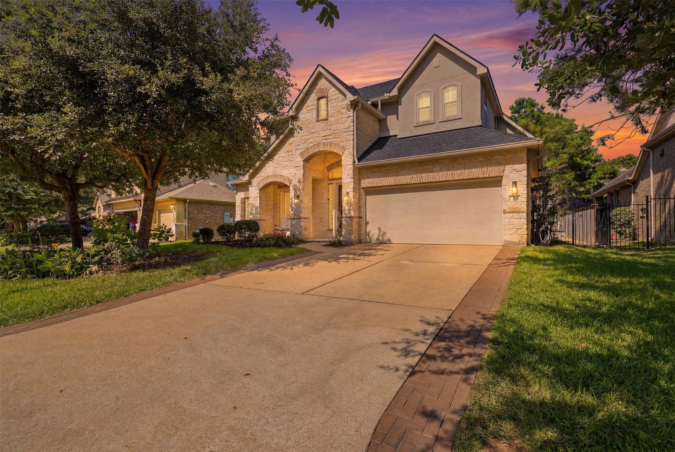 Image 2: This charming two-story home showcases an elegant