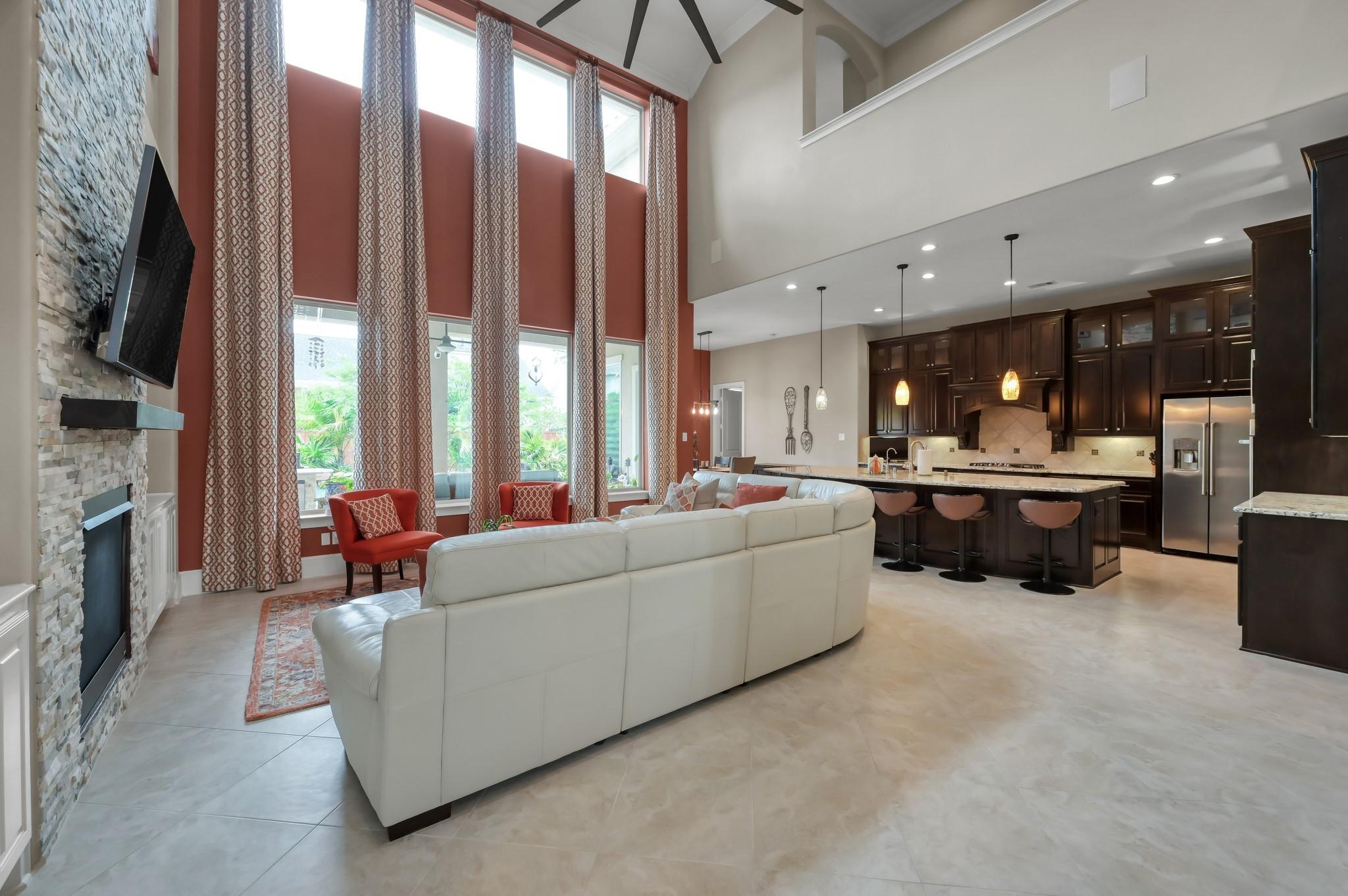 Image 3: This spacious and impressive living area features