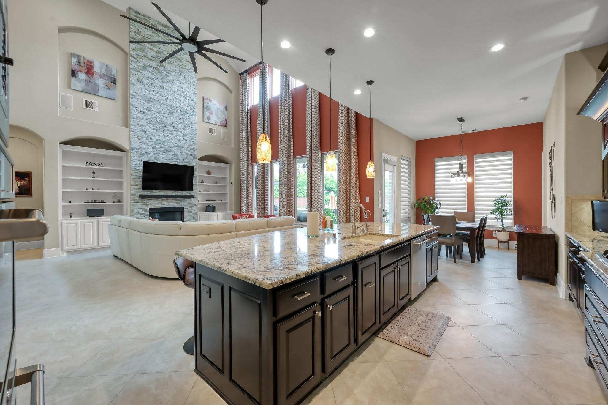 Image 4: The spacious open-concept living area features hig