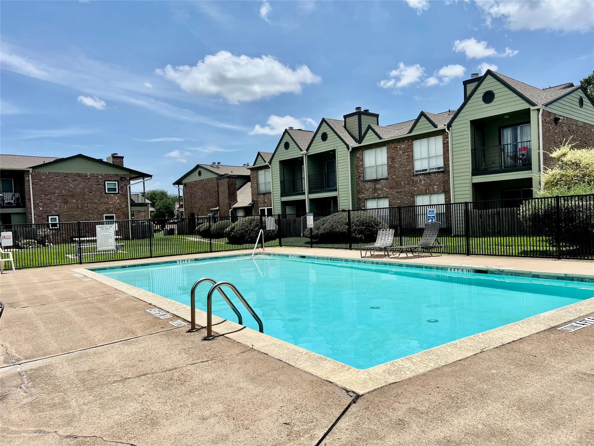Image 4: Community pool located in front of the condo.