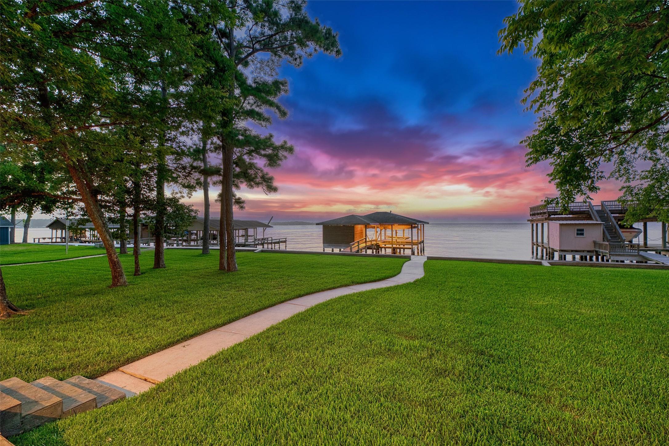 Image 1: Welcome home to breathtaking open-water views, a p