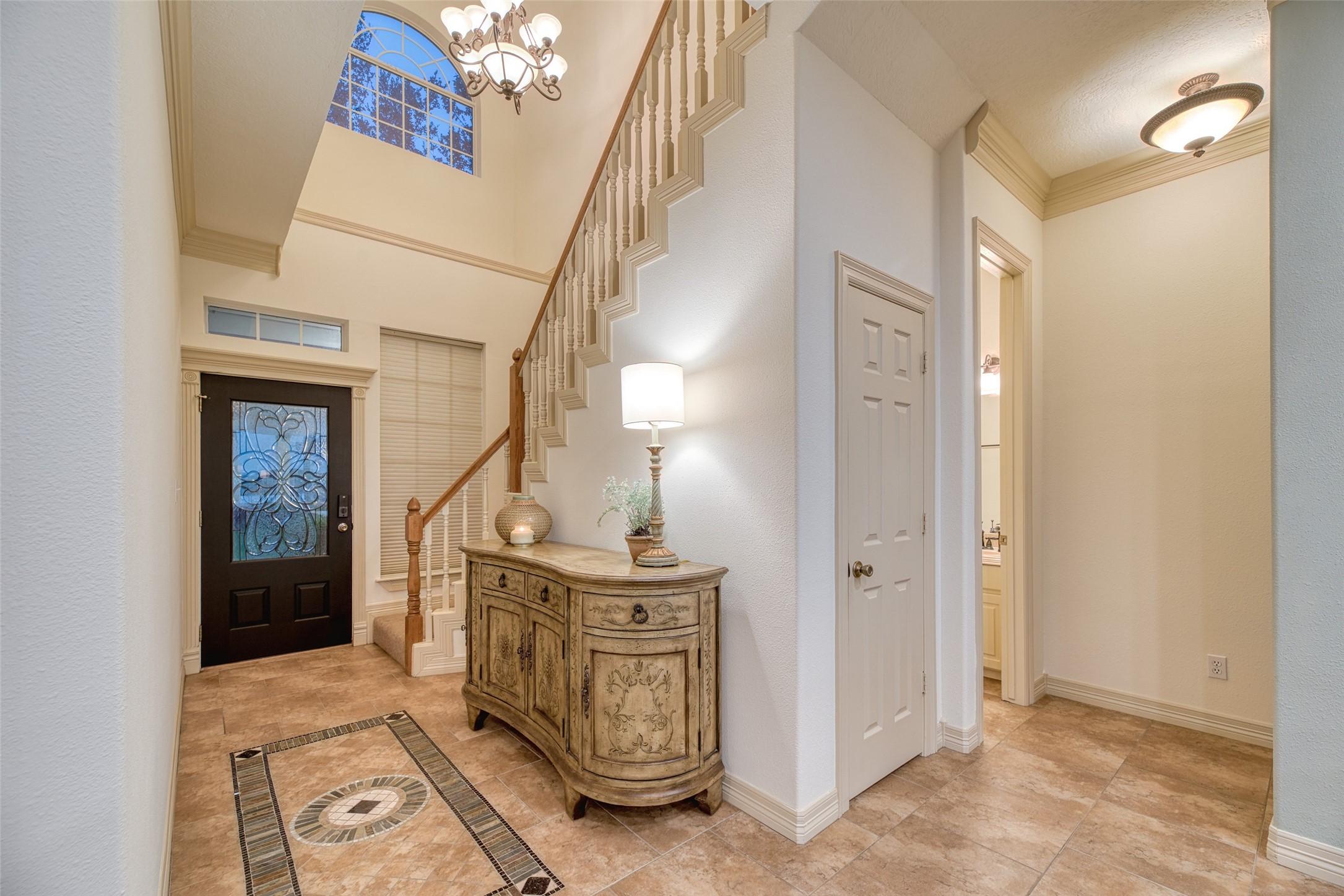 Image 3: A grand two-story foyer welcomes you with soaring