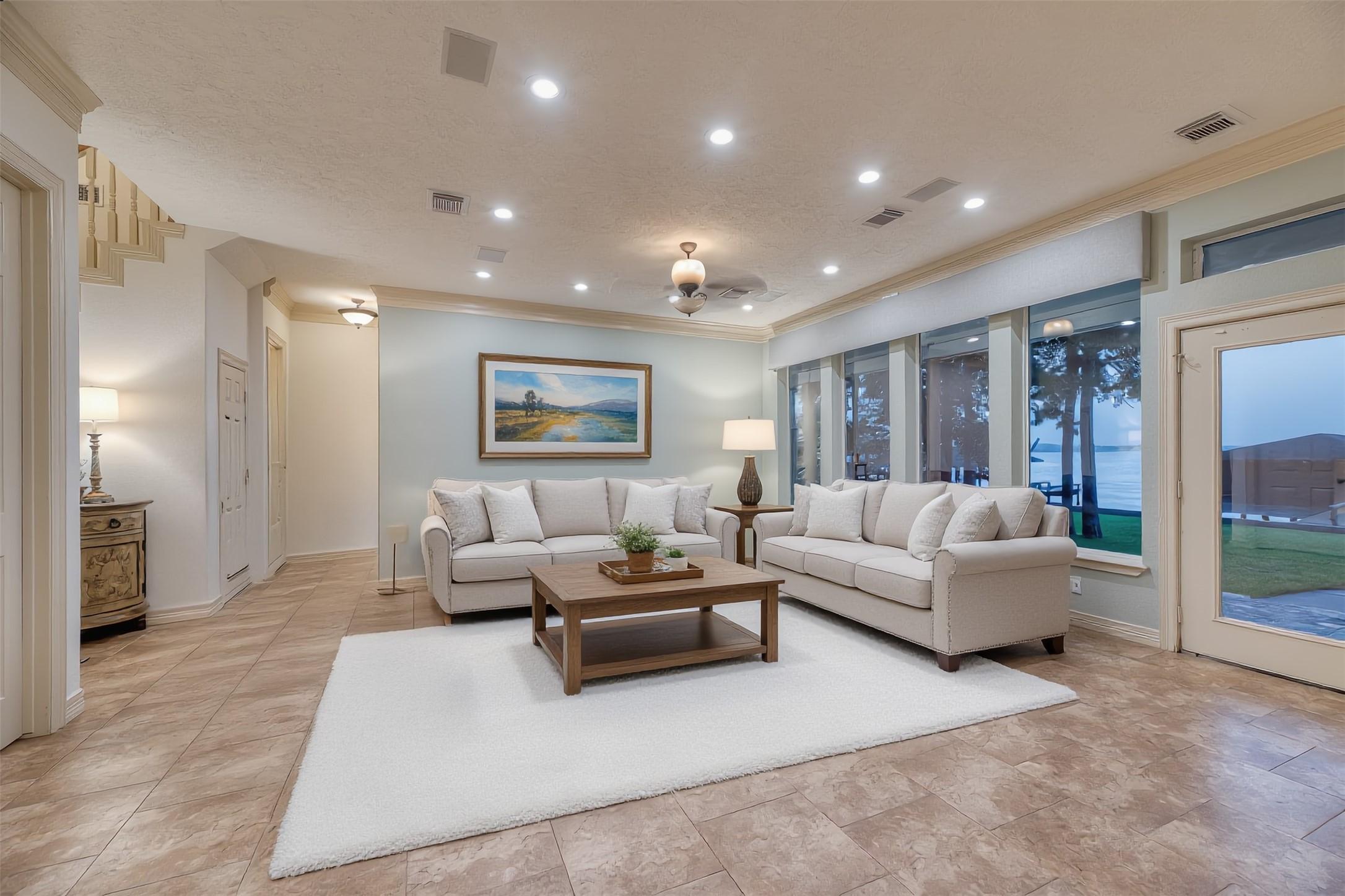 Image 4: Virtually staged family room showcasing expansive