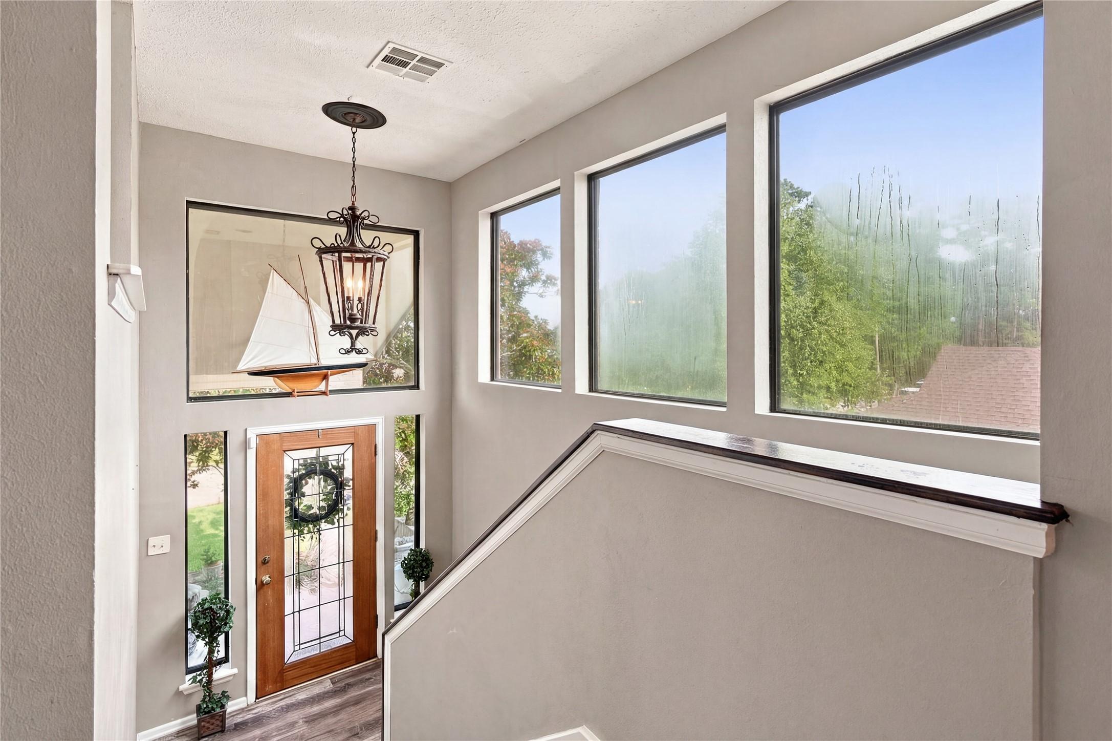 Image 4: Bright upper level accommodates the living, kitche