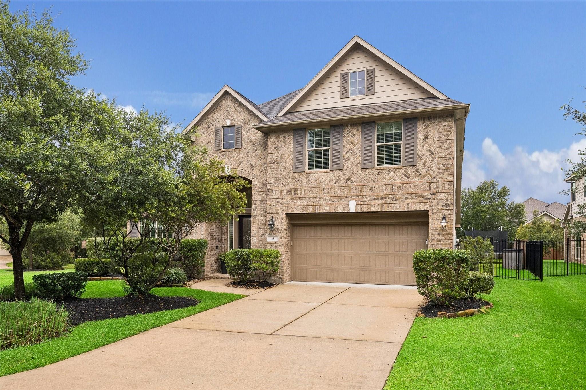 Image 2: An impressive brick facade sets the tone for this