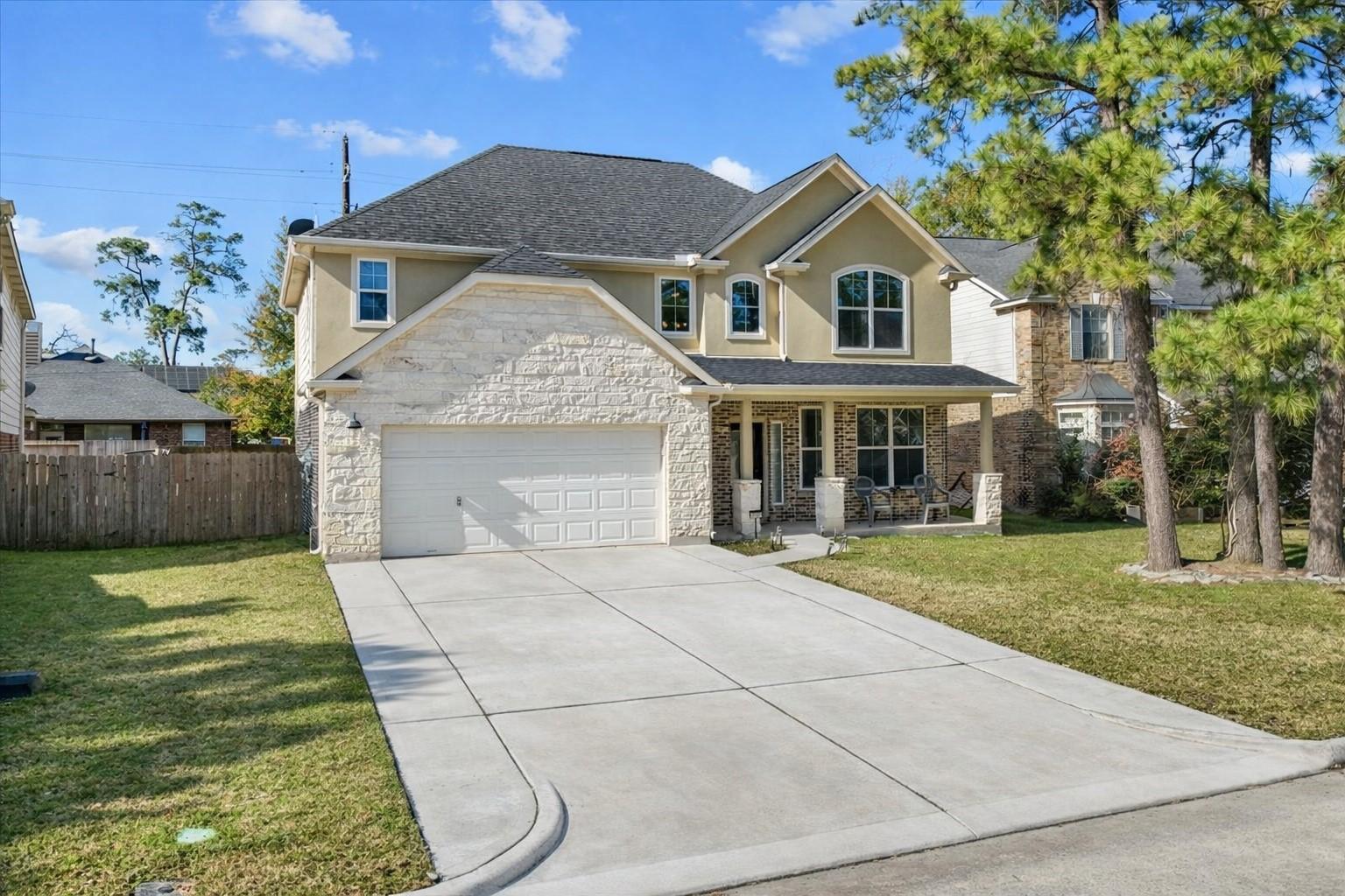 Image 2: Beautiful two-story exterior showcasing timeless c