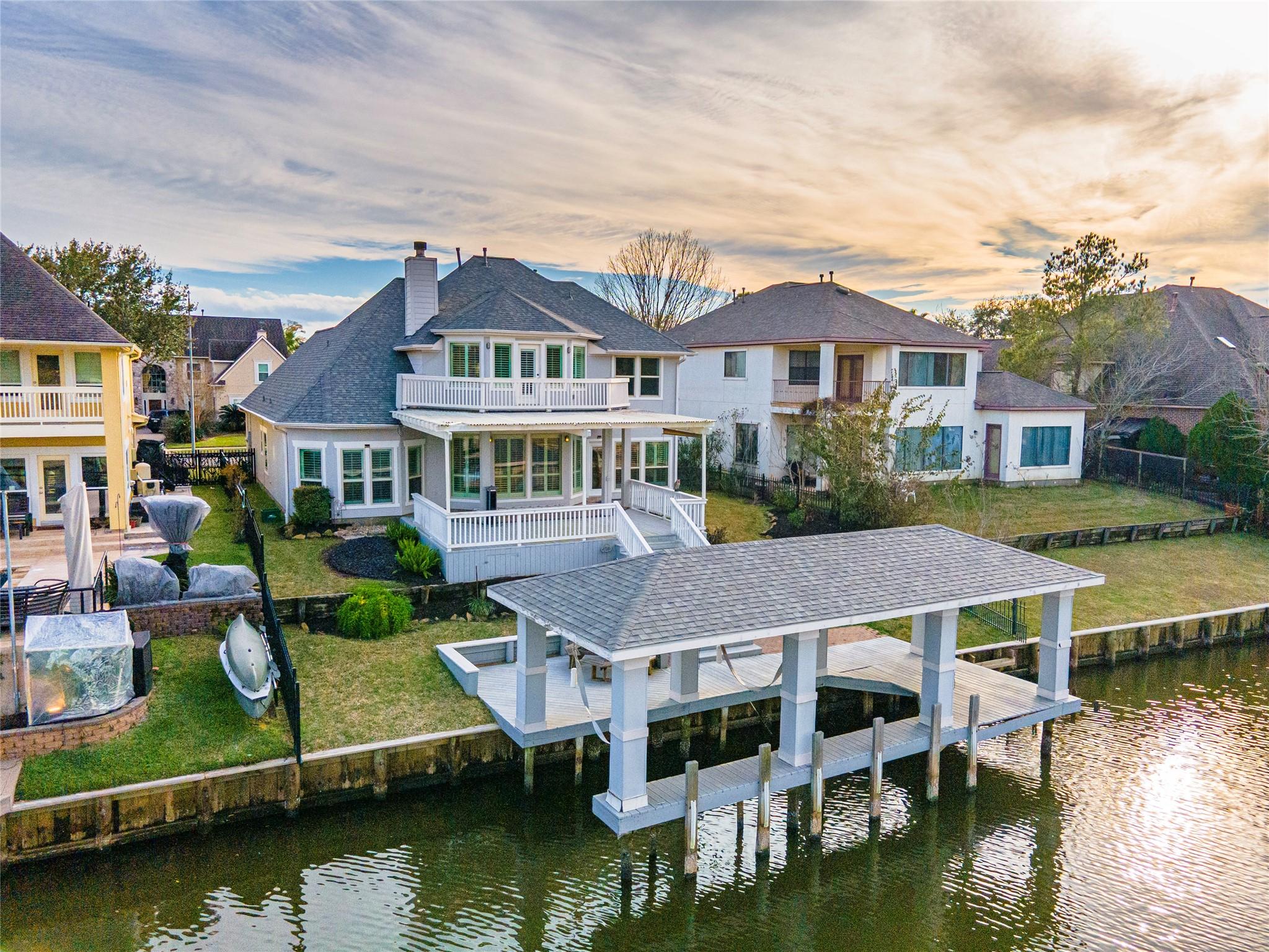 Image 1: This Stunning waterfront home features a spacious