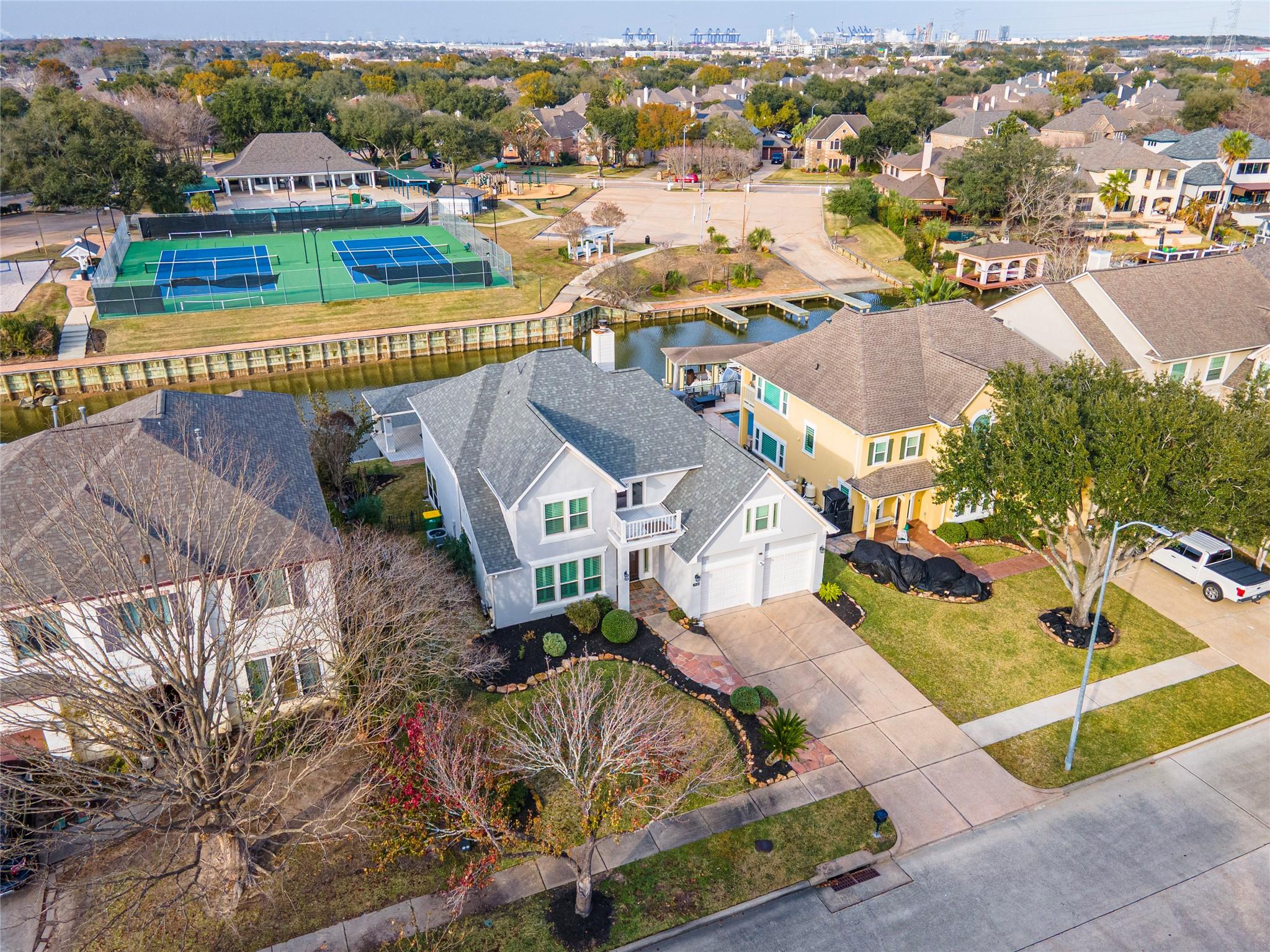 Image 3: This aerial photo showcases a charming suburban ho