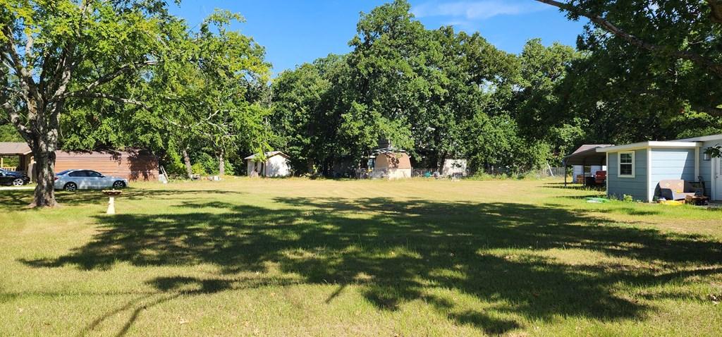 Image 2: Corner Lot, Corner lot bordered by mature trees. Ready to Build? This is the corner lot for you - Lot 282 Lide Lane & Bradleys Bend in Westwood Beach at Cedar Creek Lake.