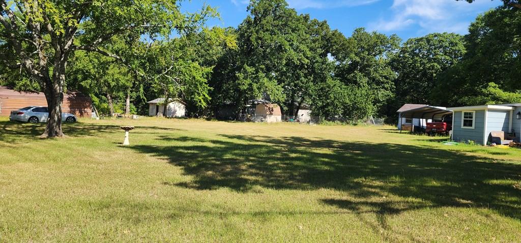 Image 3: Corner Lot, Corner lot bordered by mature trees. Ready to Build? This is the corner lot for you - Lot 282 Lide Lane & Bradleys Bend in Westwood Beach at Cedar Creek Lake.