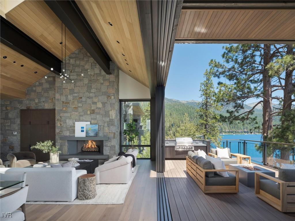 Image 1: Great Room opens to expansive deck,walls of glass
